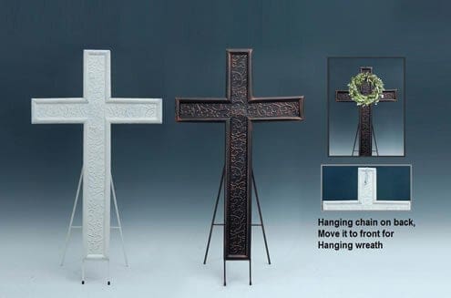 Decorative standing crosses on easels, one with a small wreath
