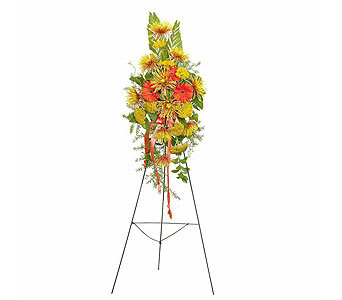 Tall floral standing spray with yellow and orange flowers on an easel