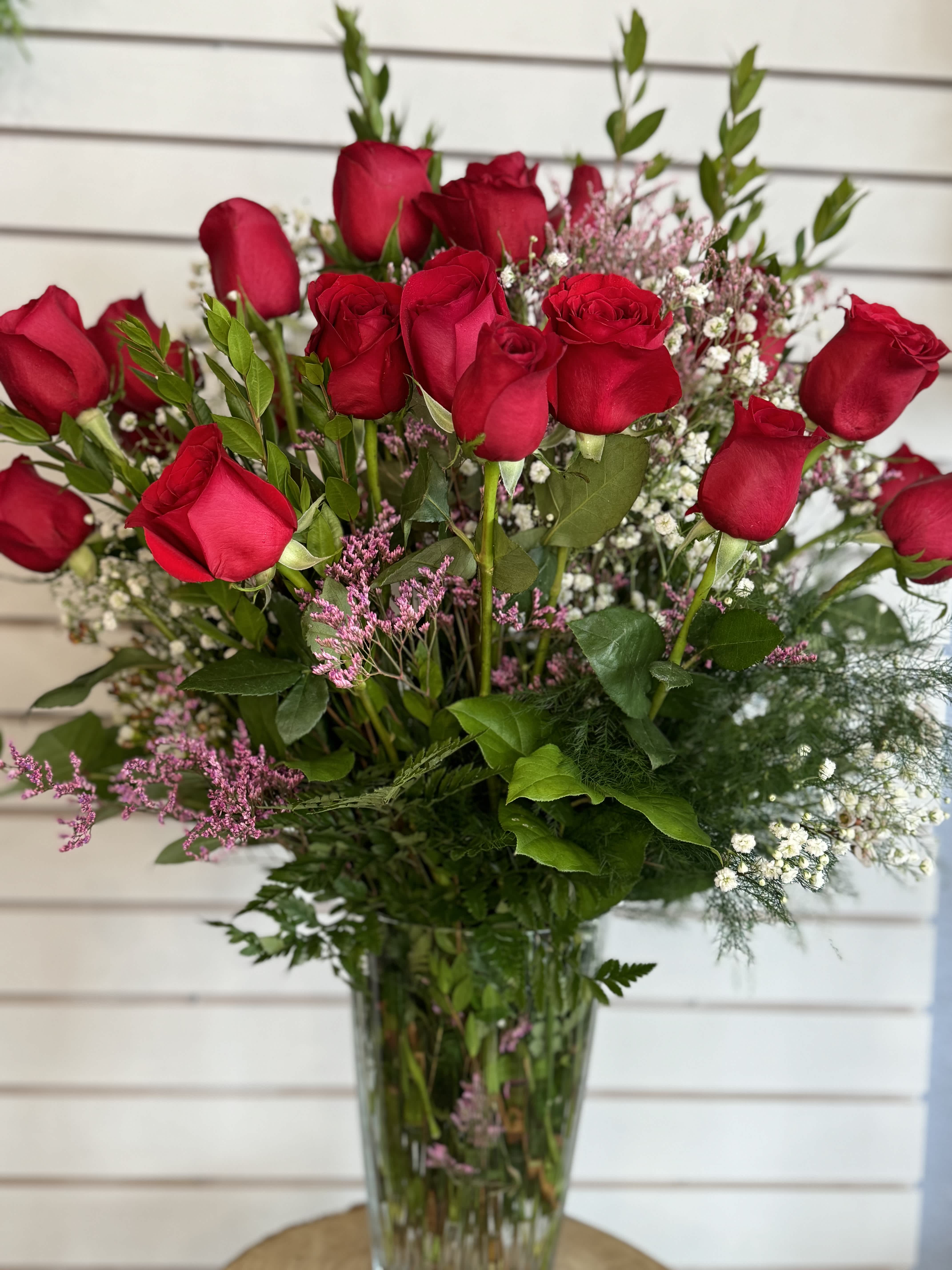 Bouquet of red roses in a clear glass vase