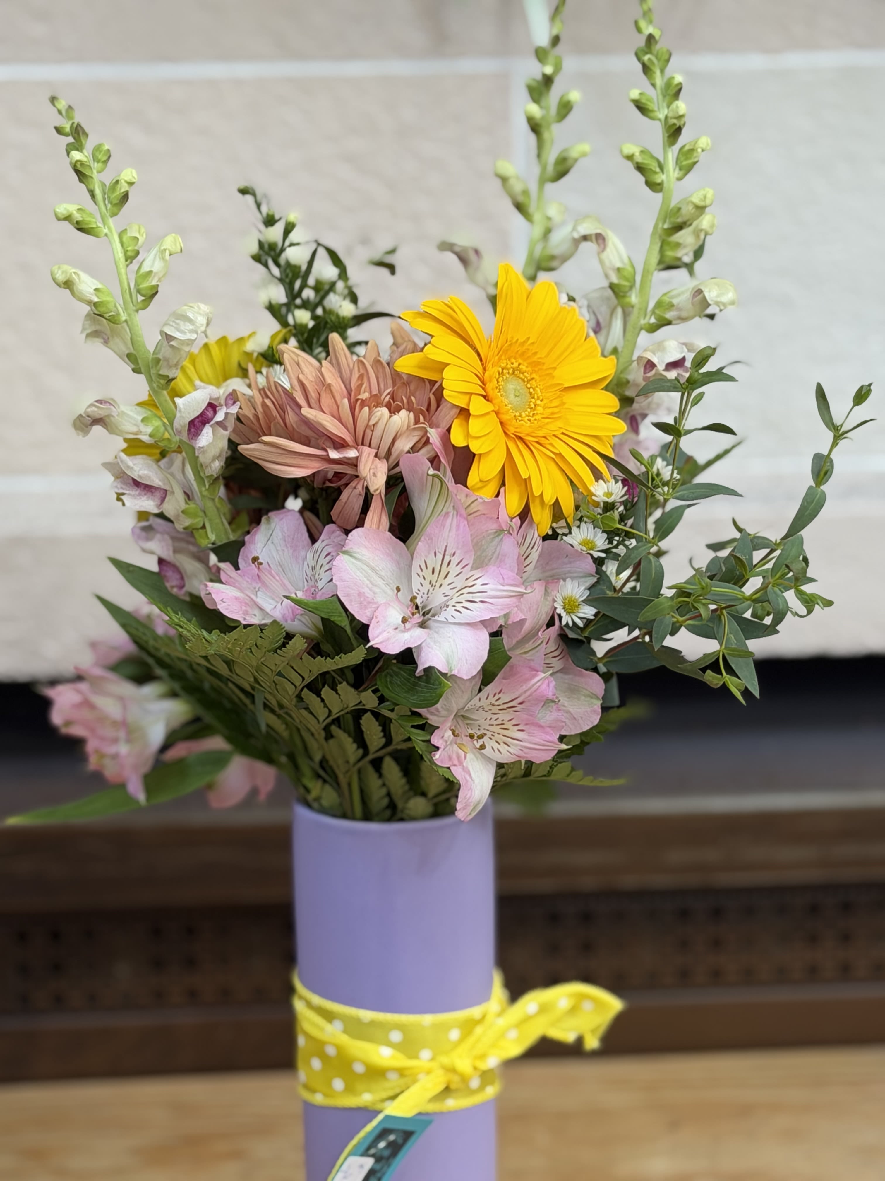 Joyful Vase  - A tall vase filled with a colorful variety of long lasting blooms. 
