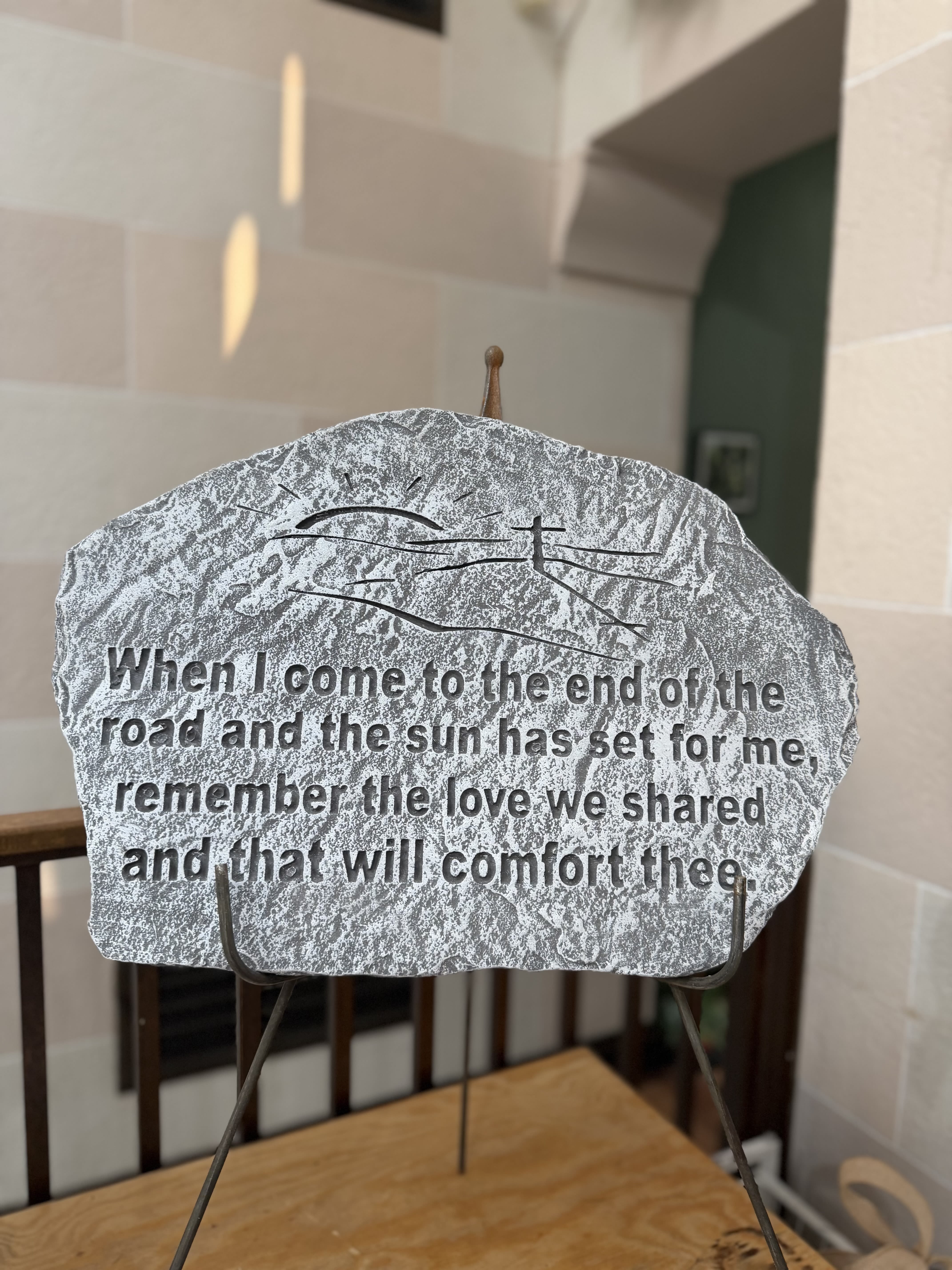 "Sun has set" Stone  - A concrete stone on a stand with a sun setting and a cross.  Stone Reads: "When I come to the end of the road a the sun has set for me, remember the love we shared and that will comfort thee." 