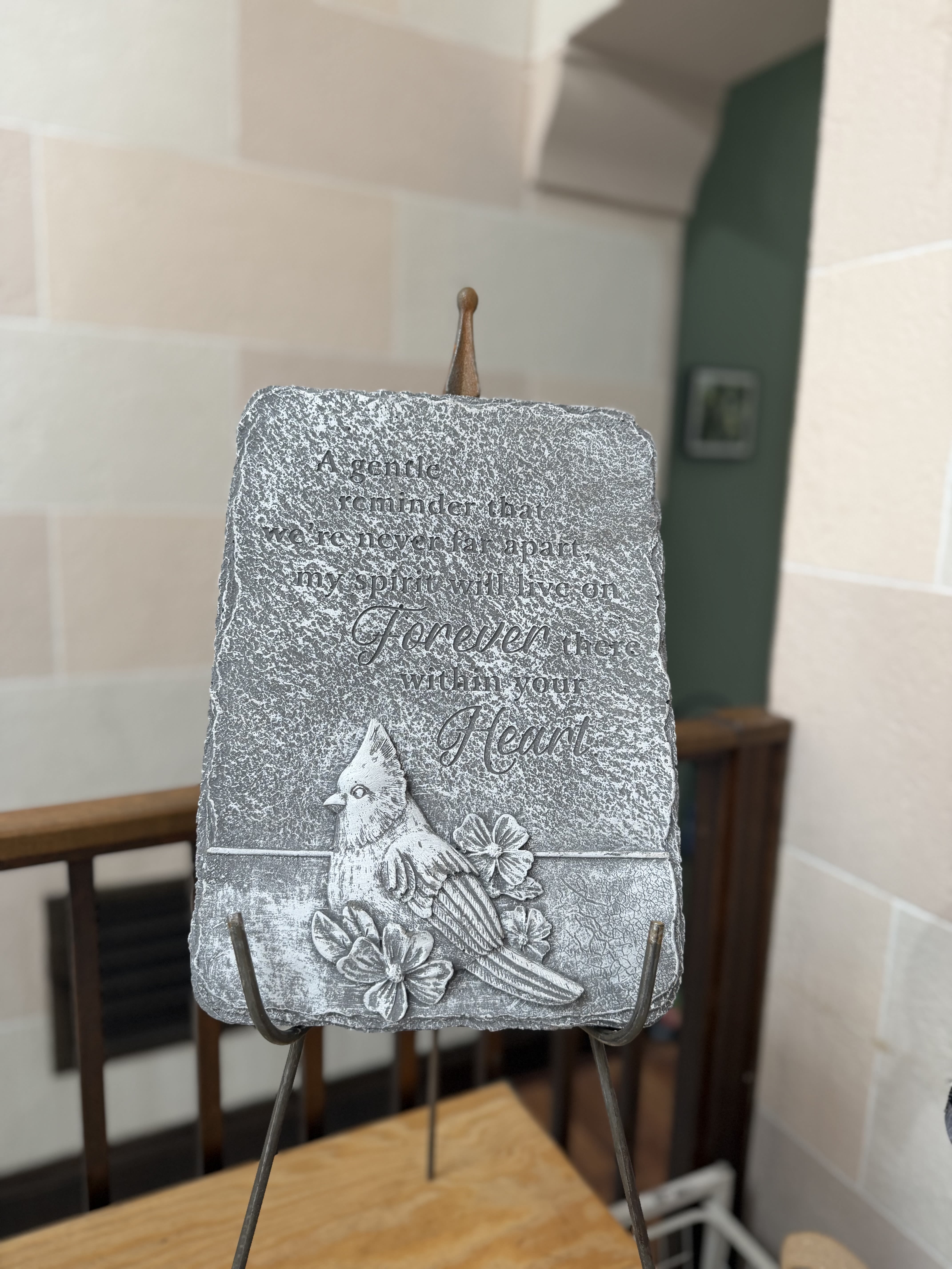 "Forever There Within Your Heart" Stone  - A concrete stone with a stand with a cardinal and flower details.  Stone Reads: "A gentle reminder that we are never far apart, my spirit will live on forever there within your heart."