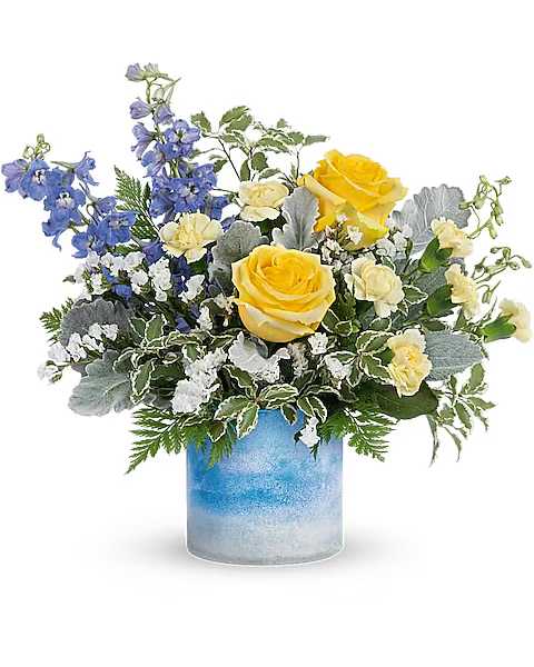 Yellow roses and blue flowers arranged in a blue glass vase
