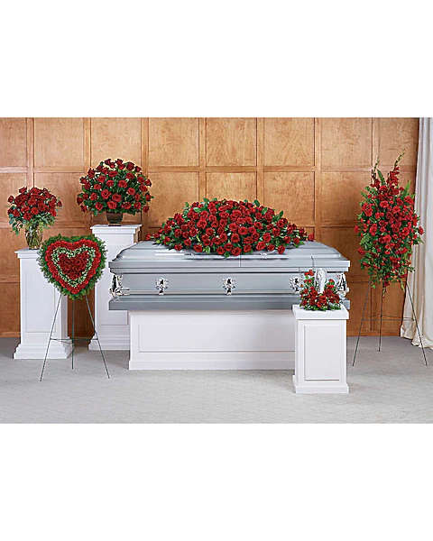 Red rose funeral casket spray with matching standing sprays and heart wreath