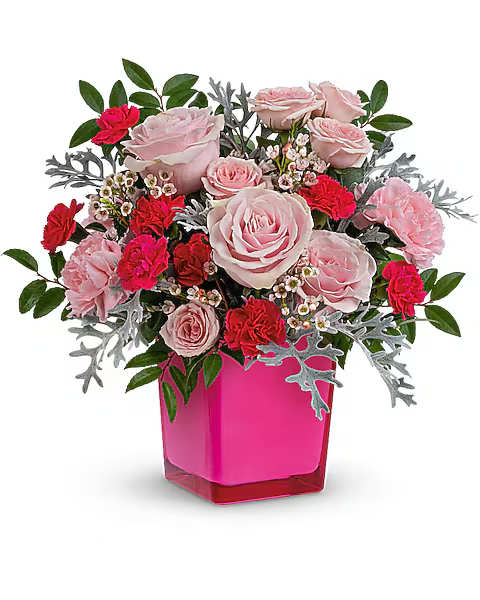 Pink roses and red carnations in a bright pink vase