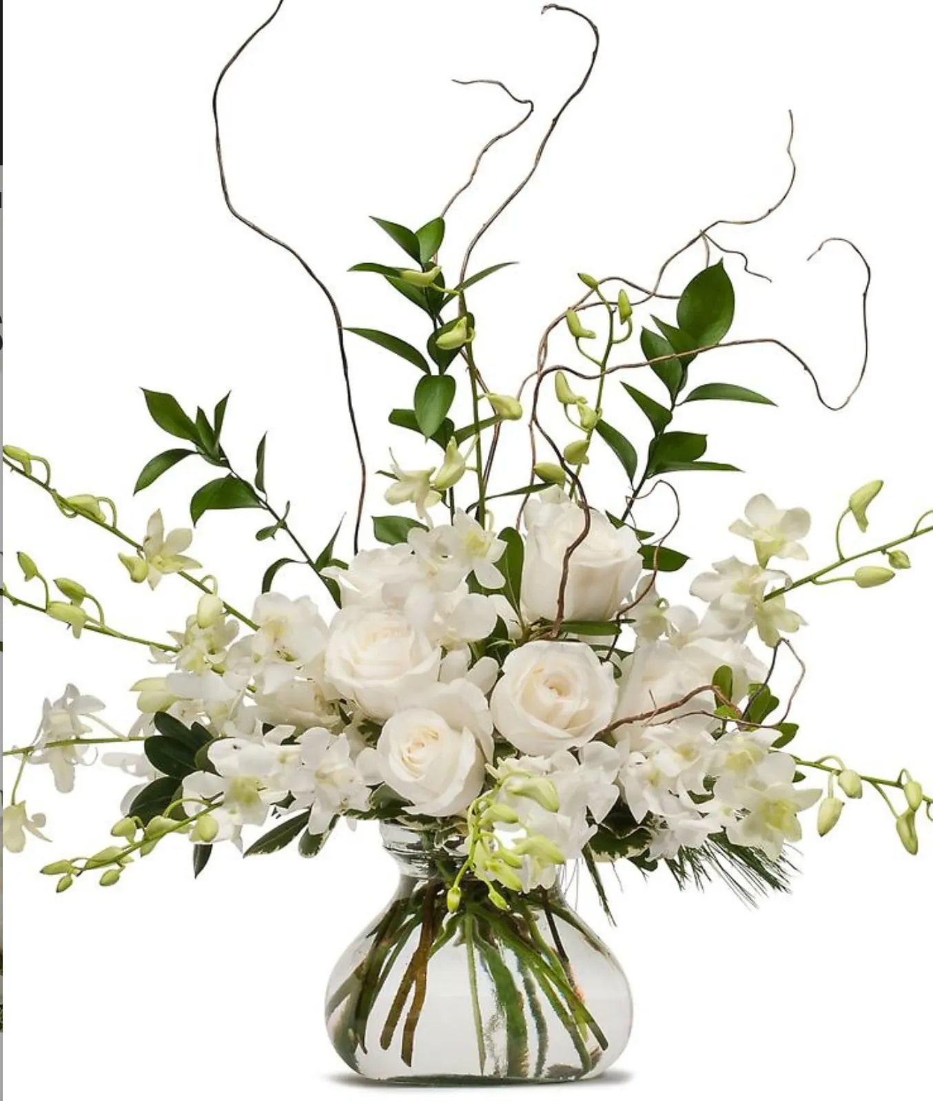 White roses and orchids in a clear glass vase