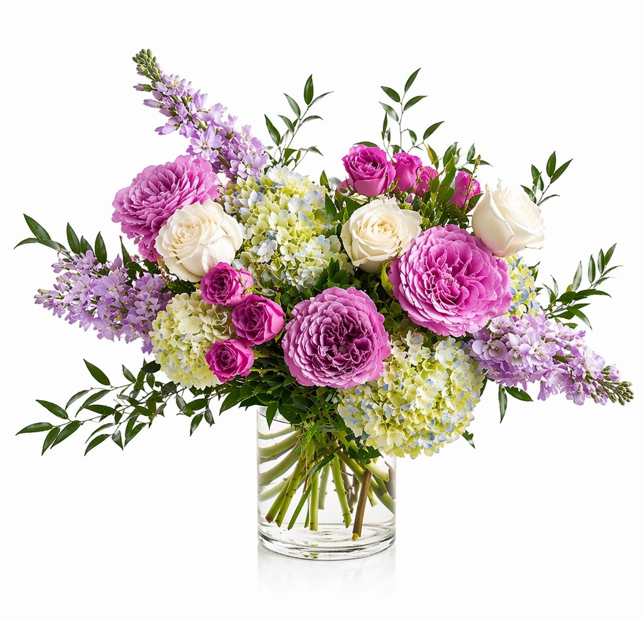 Blush &amp; Bloom - A soft, garden-inspired arrangement in a dreamy palette of blush, lavender, and fresh greens. Designed with a natural, airy feel, featuring a curated mix of seasonal blooms and textured accents. Each piece is thoughtfully arranged to highlight movement and dimension, making every version slightly unique. Flower varieties may vary based on availability while maintaining the overall color story and style.