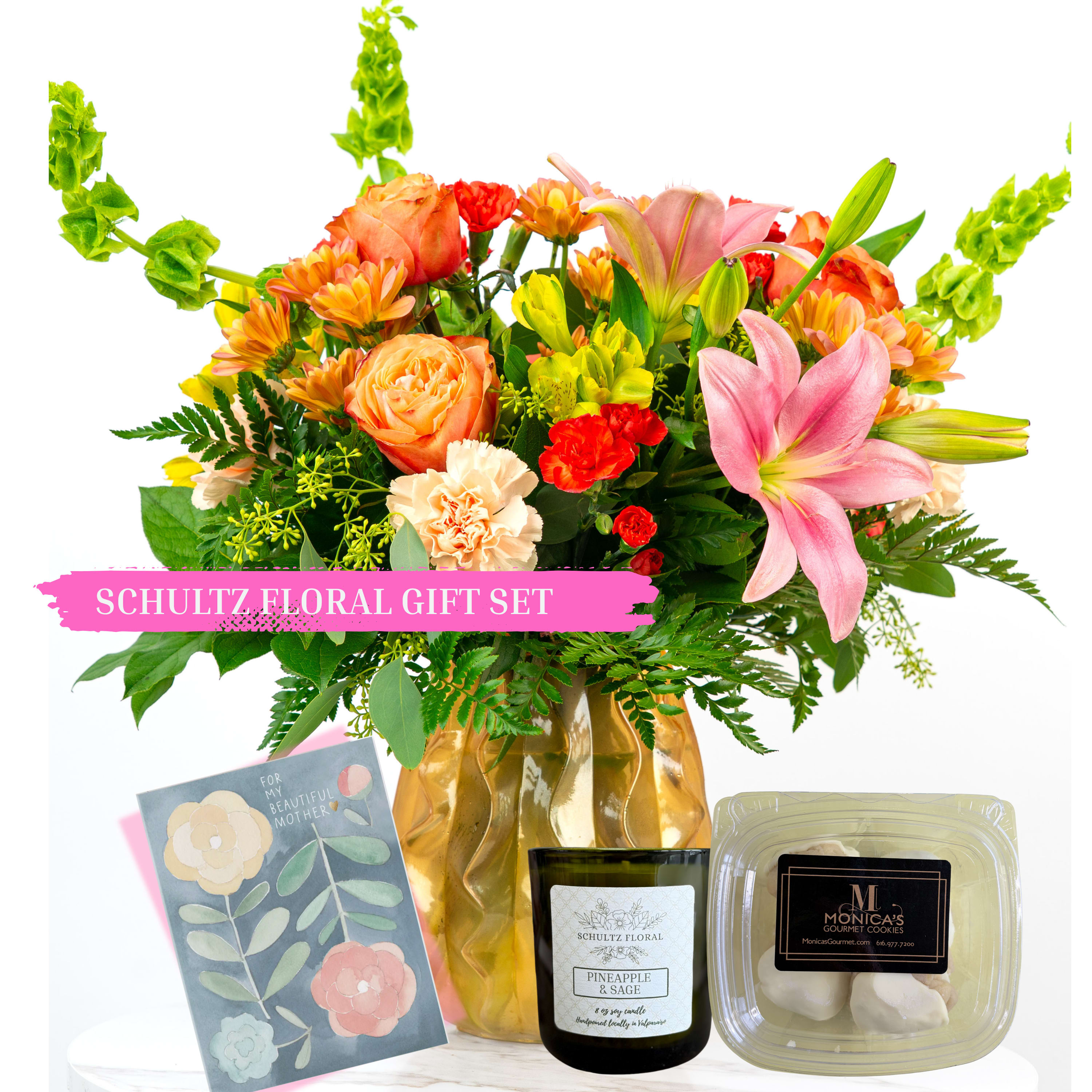 Our Mother's Day Collection: Florist's Choice Flowers and Gift Set by Schultz Floral - Celebrate your amazing Mom this Mother's Day with a large, cheerful floral mix in a stunning gold vase paired with gourmet mini cookies, a locally poured candle (8 oz.), and a handwritten Mother's Day card. We've made it easy to say "You're the Best, Mom."  This gift bundle includes: - One Premium Floral Mix arranged in a gold vase - One half-dozen box of gourmet mini cookies.  - One 8 ounce locally poured candle in our signature scent "Pineapple Sage." (Natural soy candle with cotton wick) - One handwritten Mother's Day card (designs will vary; include a your personal message during check out)
