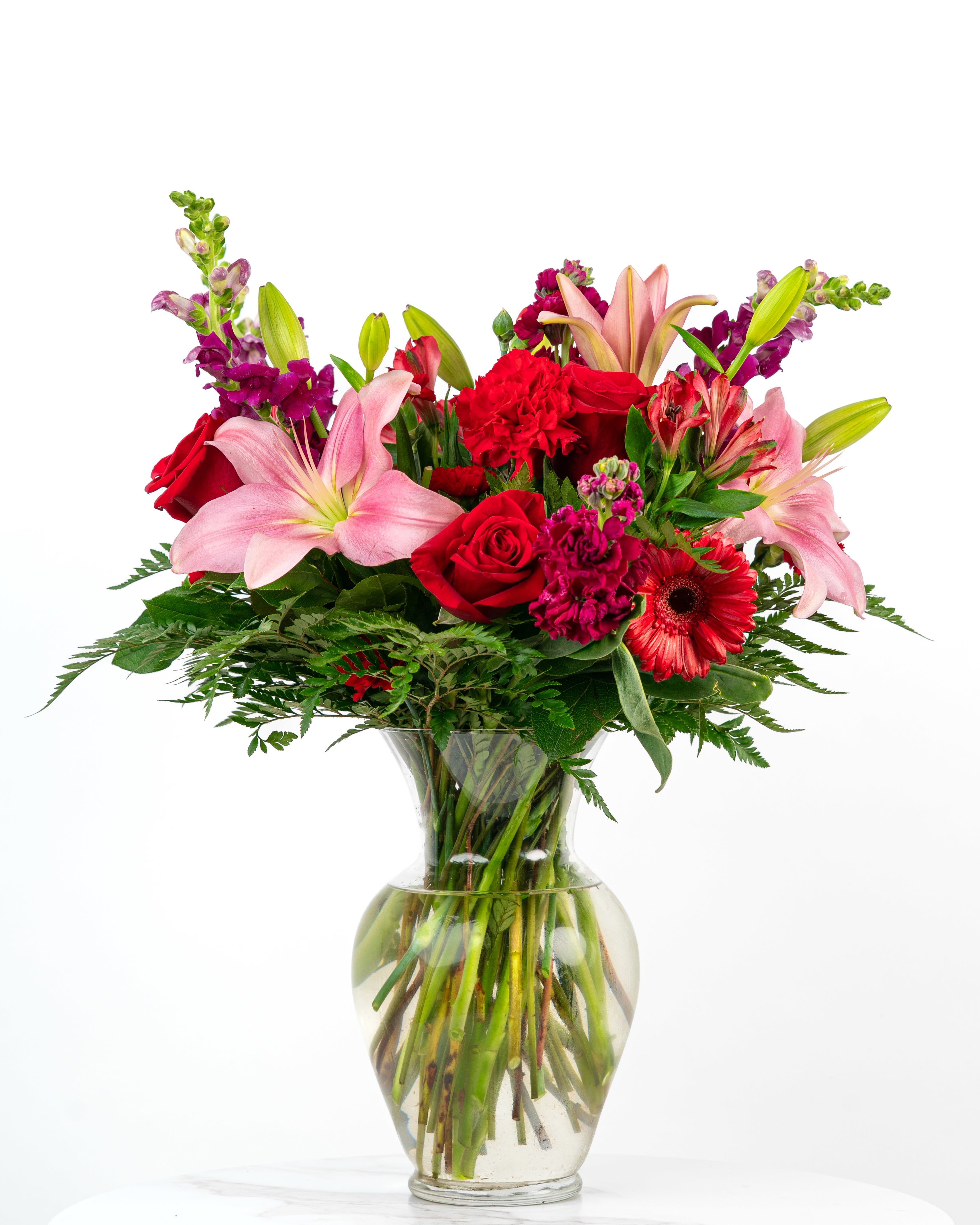 Our Timeless Collection: Red Deluxe Blooms - Our Timeless Collection's Red Blooms features elegant blooms in rich and red tones to evoke lasting beauty and classic romance. This color-rich floral arrangement is intended to celebrate someone special with timeless beauty and style. At Schultz Floral, each arrangement is one of a kind and styled just for your order. Because we always use the freshest blooms, your final arrangement may vary due to seasonal availability.