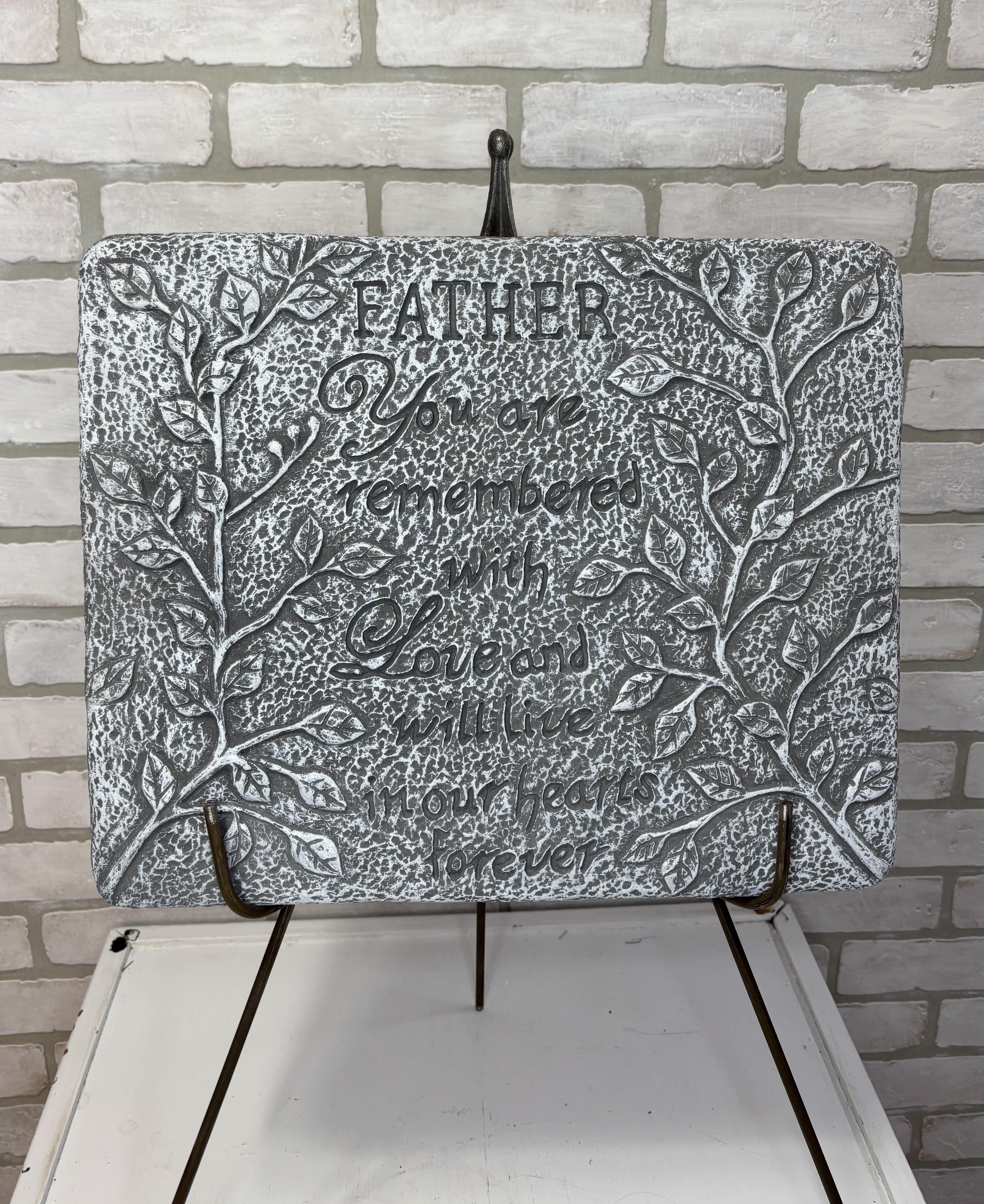 Father Stone  - A stone reading, "Father you are remembered with love and will live in our hearts forever."