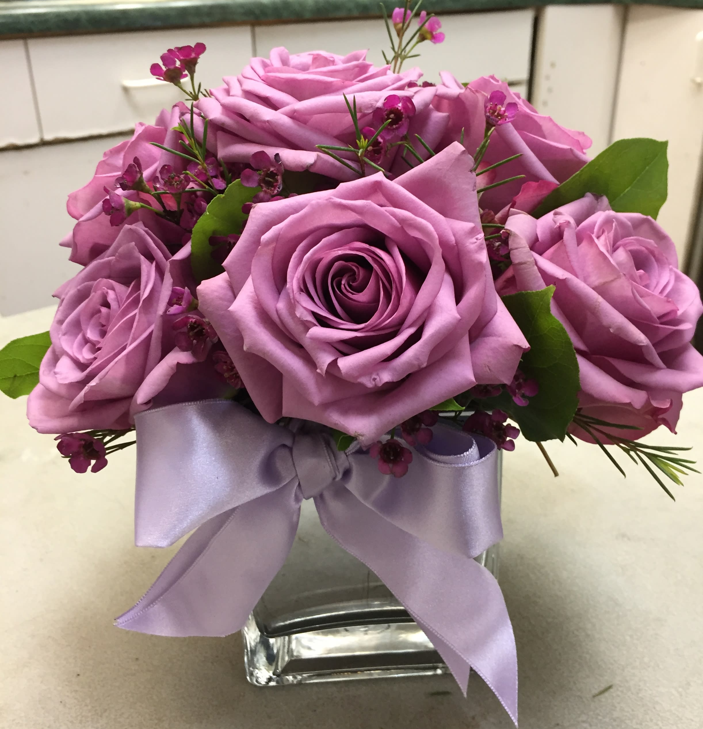  Morning Melody - Roses are in perfect harmony in this pretty arrangement that's sure to make someone's day! Roses and more, hand-delivered in a glass cube.  Comes in a variety of colors - you may ask for your preferred color under "special instructions". PLEASE NOTE: white or pink roses are in short supply and price shown will vary with market conditions