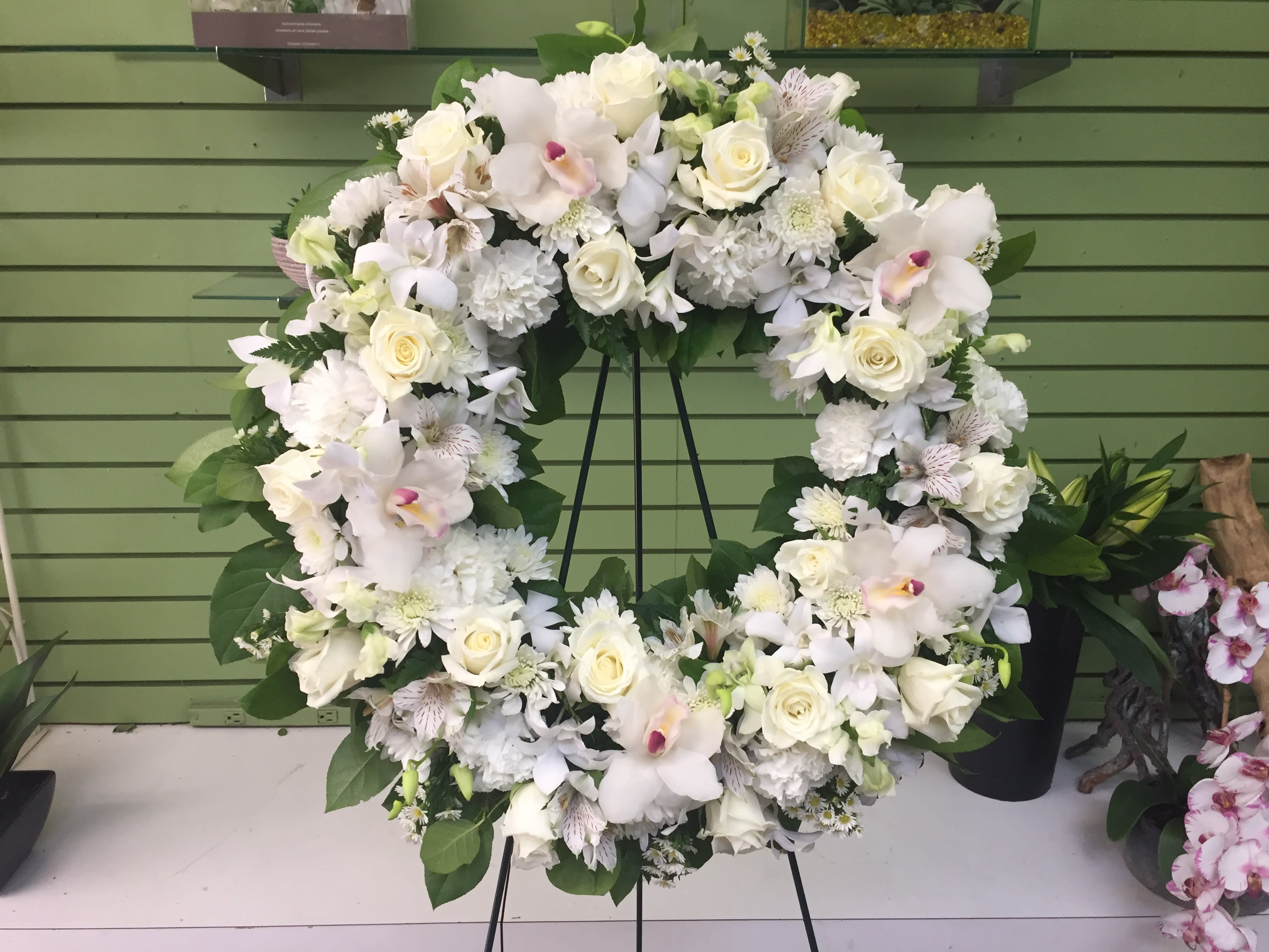 Serenity Wreath - A ring of fragrant, bright white blossoms will create a serene display at any funeral or wake. This classic wreath is delivered on an easel, and is a thoughtful expression of sympathy and admiration. 