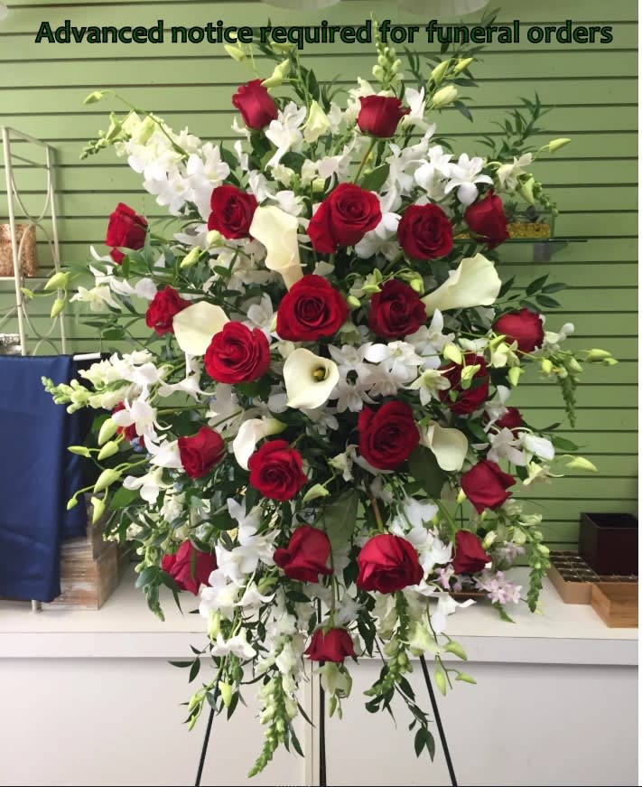 Elegant Standing Spray - Beautiful selection of premium  flowers for an elegant and stately expression of sympathy. Color and flower selection limited to available inventory. Please note that calla lilies may not always be available on short notice.