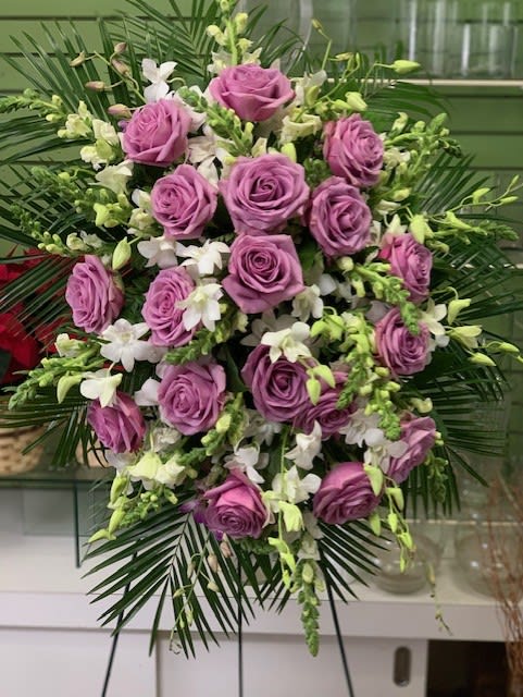 Lavender rose and white orchid standing spray with palm fronds