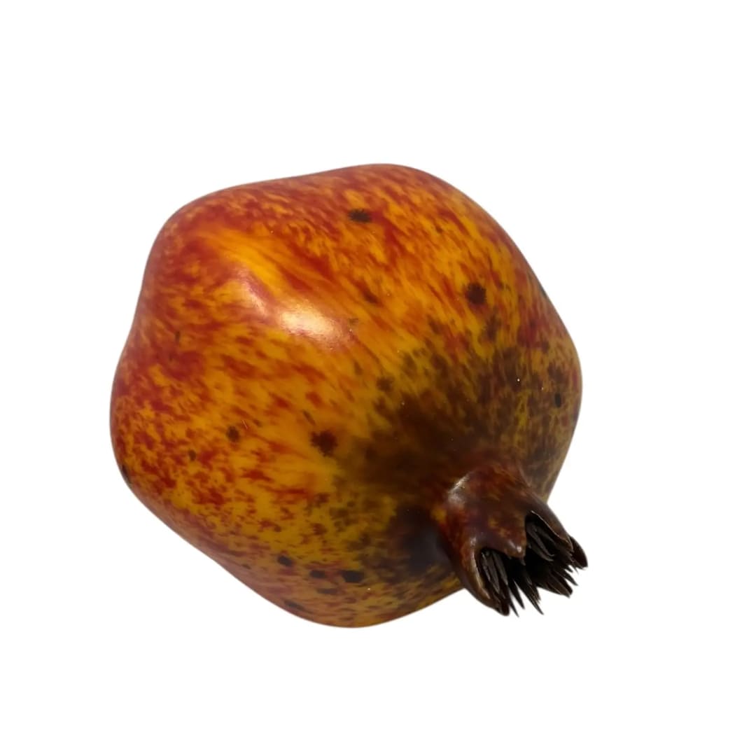 Single pomegranate on a white background