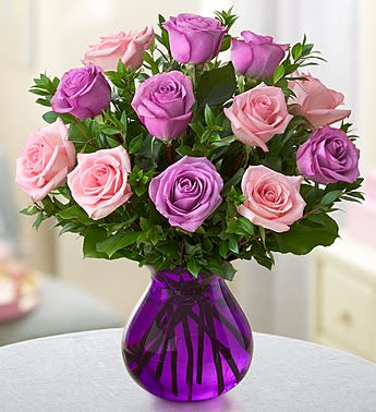 Rose Romance - Product ID: 105141  EXCLUSIVE When it comes to being romantic, you can never go wrong with roses! One dozen fresh, gorgeous blooms in a mix of pink and purple are hand-gathered by our expert florists in a purple glass vase to help you express all the love thatâs in your heart. One dozen of our freshest pink and purple roses, arranged with salal and myrtle Hand-gathered by our florists in a purple glass vase; measures 7"H Each arrangement measures approximately 17.5"H x 15"L Our florists select the freshest flowers available, so floral colors and varieties may vary