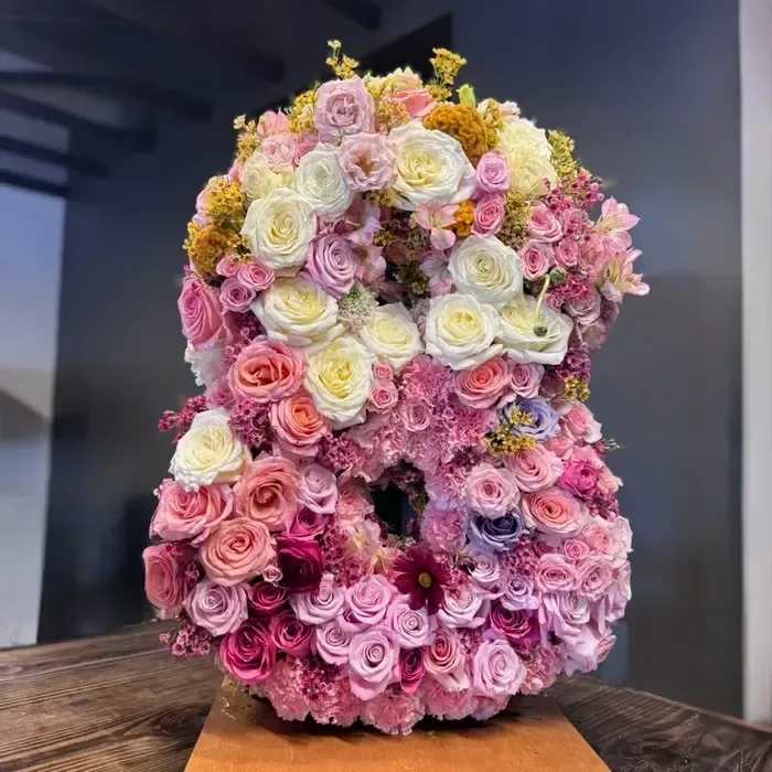 Floral Initial or Number - Make any celebration unforgettable with our custom floral letters and numbers. Each piece is thoughtfully designed with fresh seasonal flowers, creating a one-of-a-kind arrangement that’s as personal as it is beautiful.  Whether you’re surprising someone with their initials for a birthday, marking a special milestone with anniversary numbers, or decorating for an event, these standing floral designs are a stunning way to make a statement. Perfect for weddings, parties, showers, or sympathy tributes, they add elegance, color, and meaning to any occasion.  Choose your letter or number, and let us create a show-stopping floral piece that speaks from the heart.  Product ID: floral-initial-number 