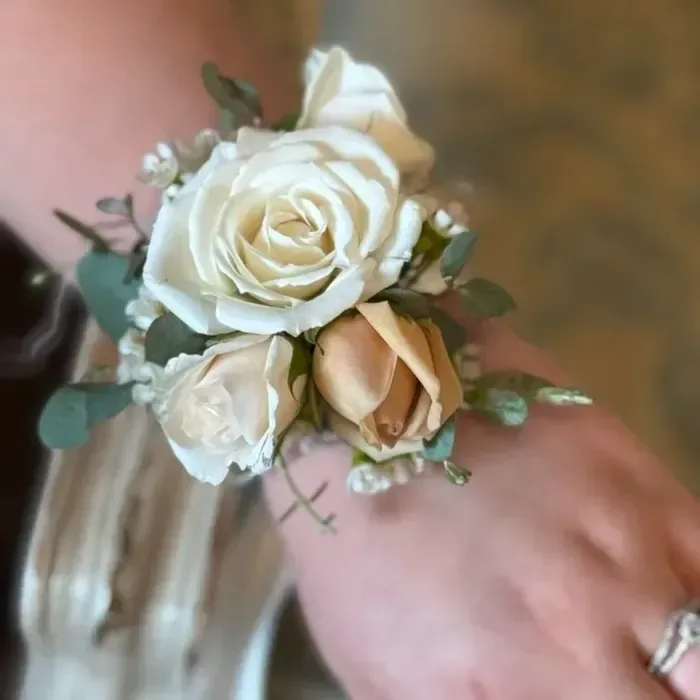 Corsage - Wearable floral accents for the ladies. Created in your selected colour palette. Choose either a lapel corsage or wrist corsage.  Please refer to the photos for the available color options and specify your choice in the florist instructions.  Product ID: Corsage-1