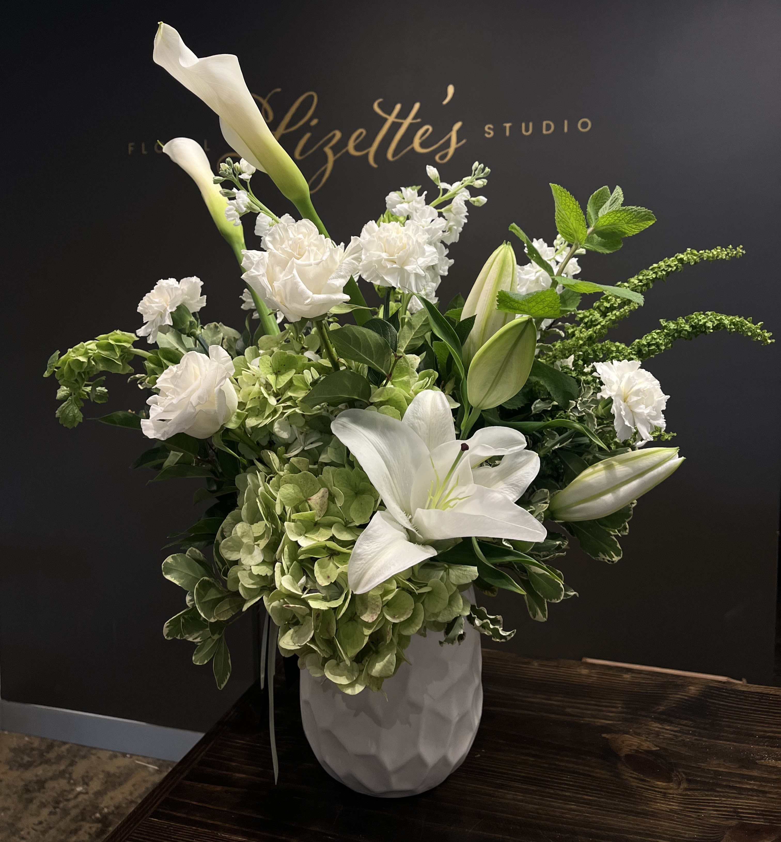 Neutrals Designer’s Choice -- Elegant Flower Arrangement in a Vase - Elevate any space or occasion with our Neutrals Designer’s Choice flower arrangement, featuring a curated selection of fresh, seasonal blooms in soft, neutral tones. Handcrafted by our expert florists, this vase arrangement showcases cream, ivory, beige, and muted greenery for a timeless, sophisticated display.  Perfect for home décor, weddings, anniversaries, sympathy gifts, or elegant events, this arrangement highlights the beauty of seasonal flowers while maintaining a serene, understated elegance.  Ordering Information: Each bouquet is handcrafted with premium, fresh flowers. Please place orders in advance to ensure availability.  Note: Flower types, colors, and vase style may vary depending on seasonal availability.  Product ID: Neutrals-Designer's-Choice