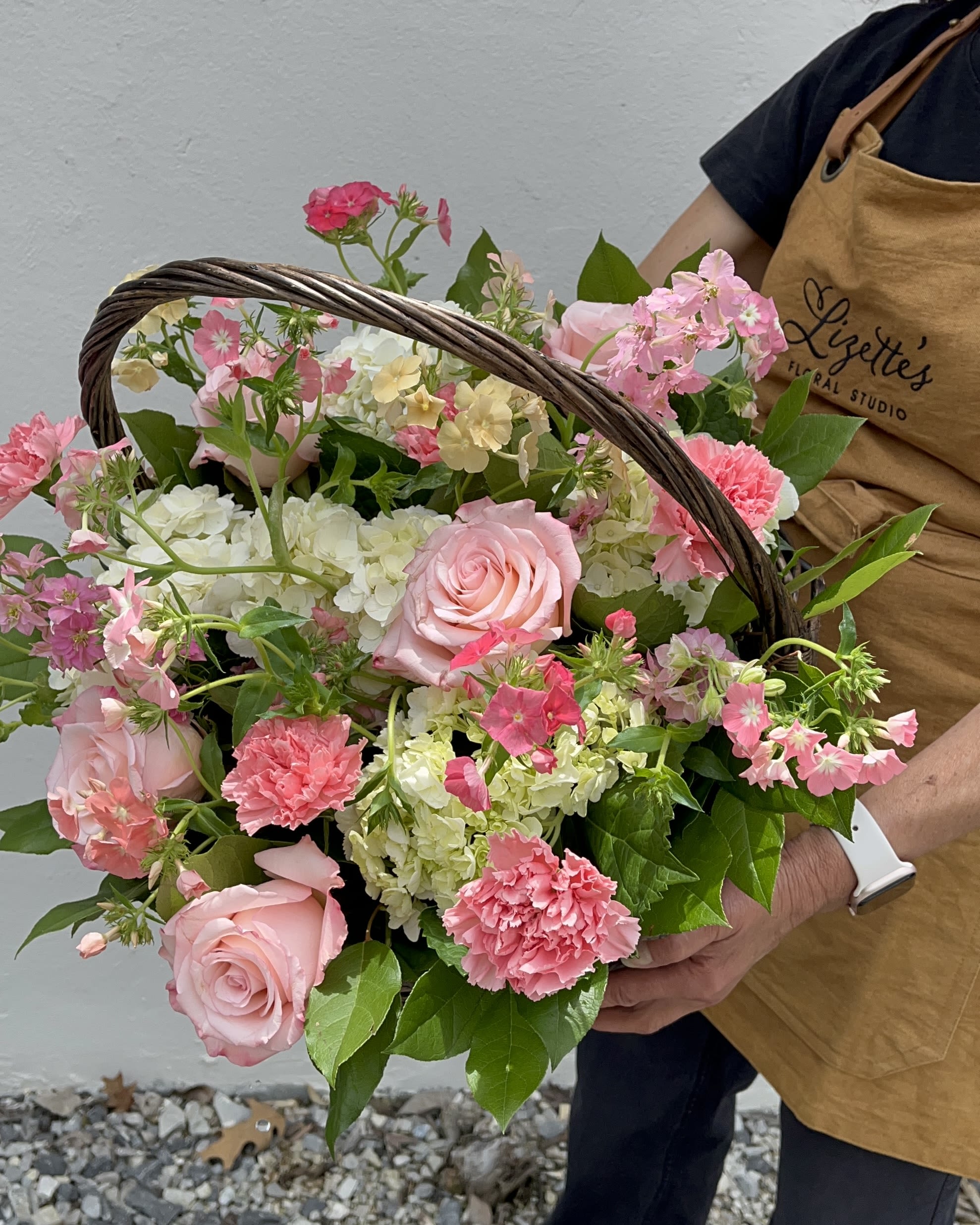 The Brambled – All Pink Flower Basket in Chattanooga, TN - Surprise your loved ones with The Brambled, a rustic flower basket bursting with all types of pink flowers, including hydrangeas, roses, and seasonal blooms. Expertly arranged by our Chattanooga florists, this hand-picked bouquet captures the natural, untamed beauty of a wild garden in shades of pink.  Perfect for birthdays, anniversaries, thank-you gifts, housewarmings, or just because, this pink flower arrangement brings freshness, beauty, and rustic elegance to any home or office.  Order Your Pink Flower Basket: Each basket is handcrafted with premium, fresh seasonal flowers. Place your order in advance to ensure availability. Delivery available in Ooltewah and the Chattanooga metro area.  Product ID: The-Brambled