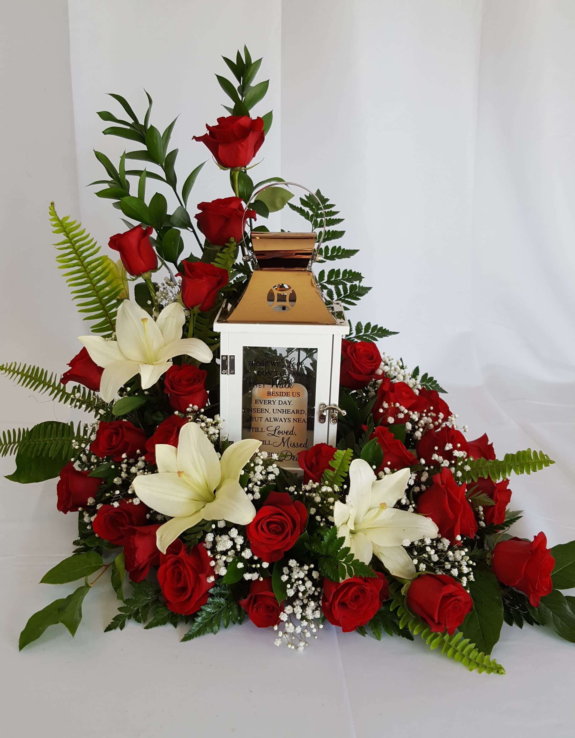 Keepsake Lantern with Roses &amp; Lilies - A thoughtful expression of sympathy. A keepsake lantern surrounded by beautiful roses and lilies. 