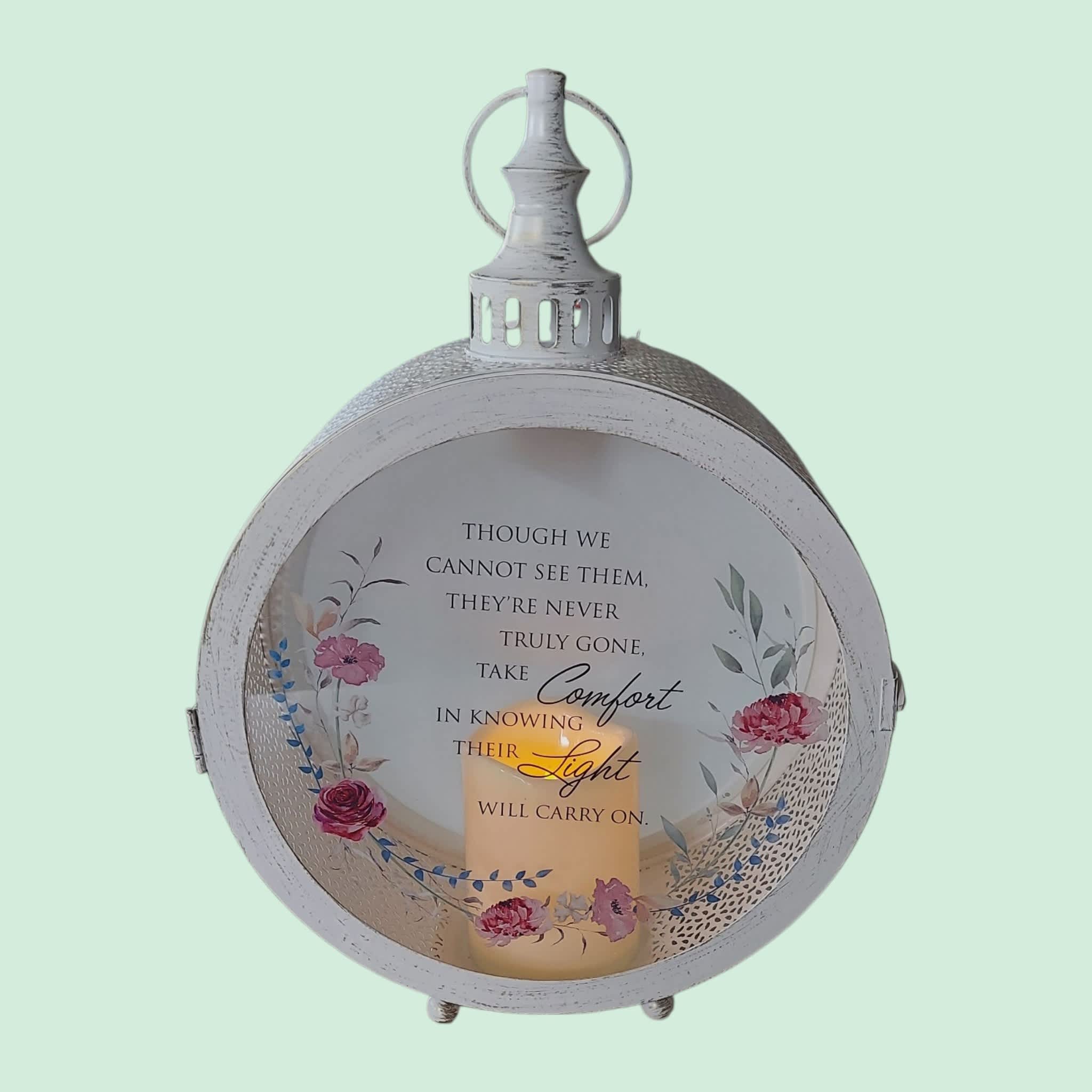 Decorative lantern with a memorial quote and floral accents
