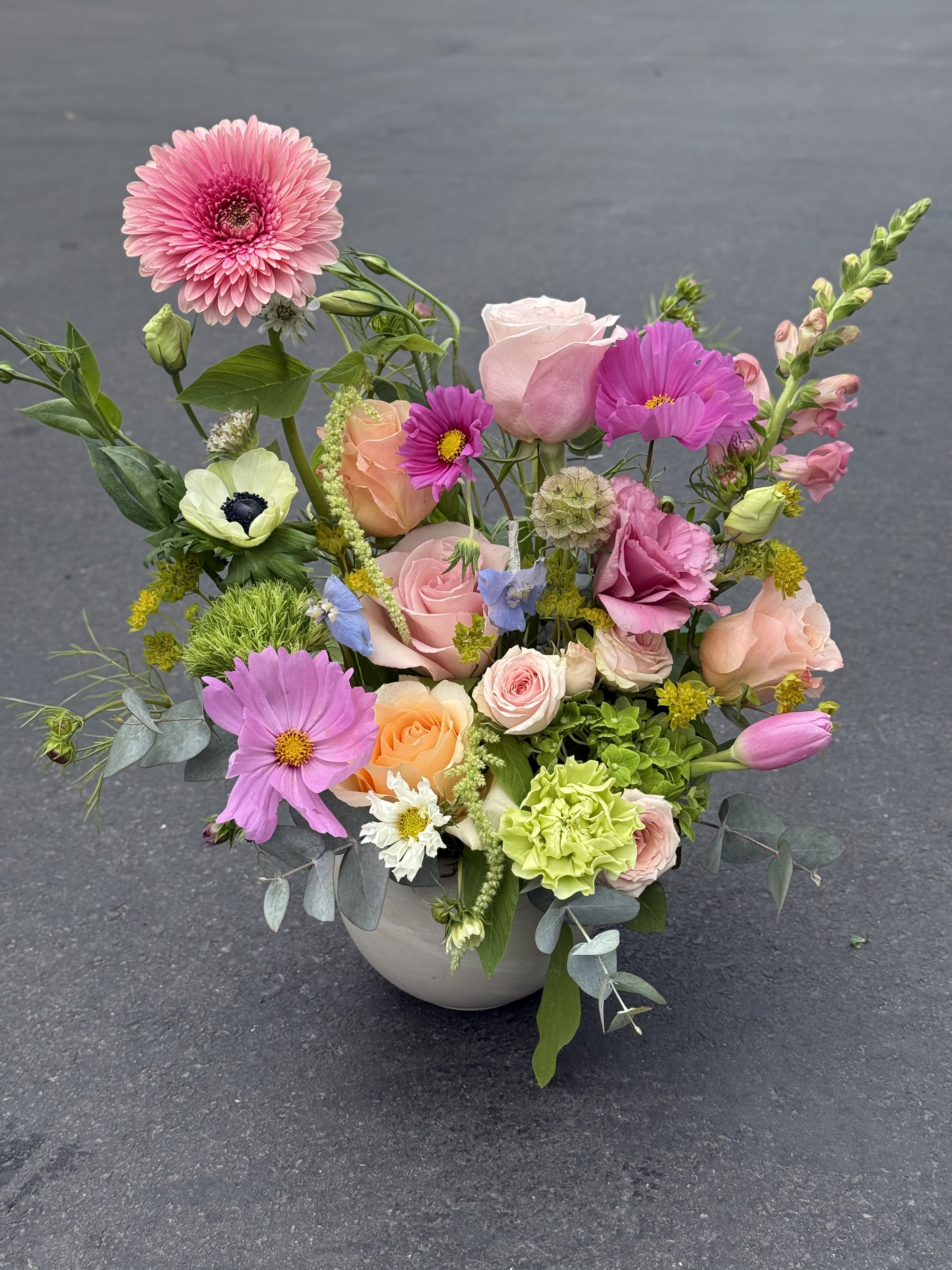 Alegría - Pink, purple, peach and white garden-style arrangement of gerbera, roses, tulips, carnations and anemone in a ceramic vase - fresh, airy and cheerful for birthdays or spring gifting.