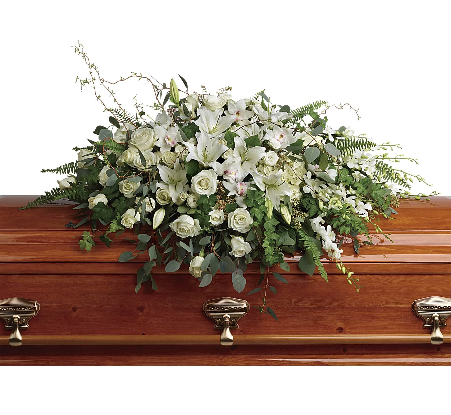 White floral casket spray with roses and lilies on a wooden casket