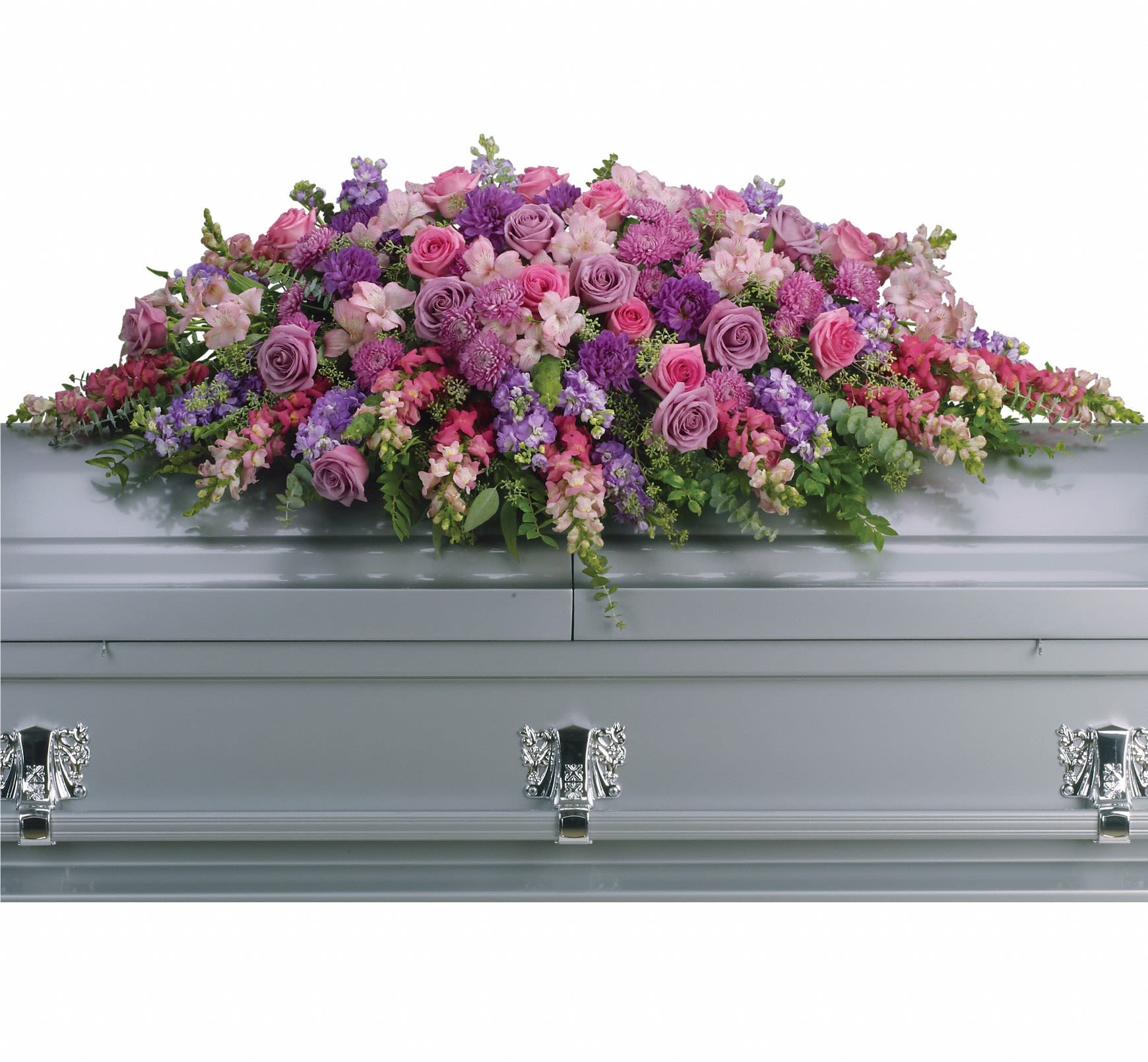 Lavender and pink floral casket spray on a gray casket