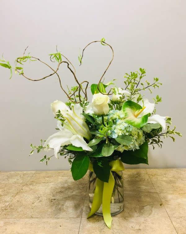 Ooh La La! - A textured blend of lilies, butterfly anthurium, and hydrangea.  Note: Due to seasonality and availability, we may at times need to substitute some floral components in your arrangement. Should this occur, be assured that your substitutions will be of equal or greater value. Mahalo!