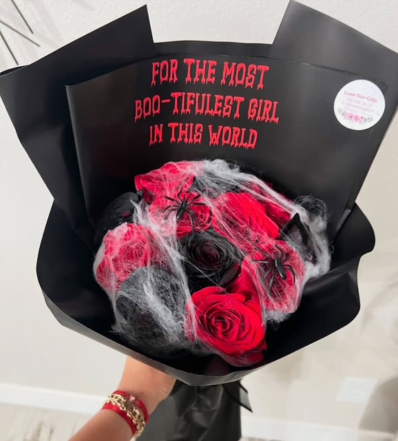 Boo-tiful Roses Bouquet - Celebrate love with a spooky twist! This enchanting bouquet combines elegant roses with Halloween-inspired accents like spider webs, bats, and ghost details. Perfect for surprising your “boo” this spooky season. Ideal for Halloween dates, October birthdays, or just because. 