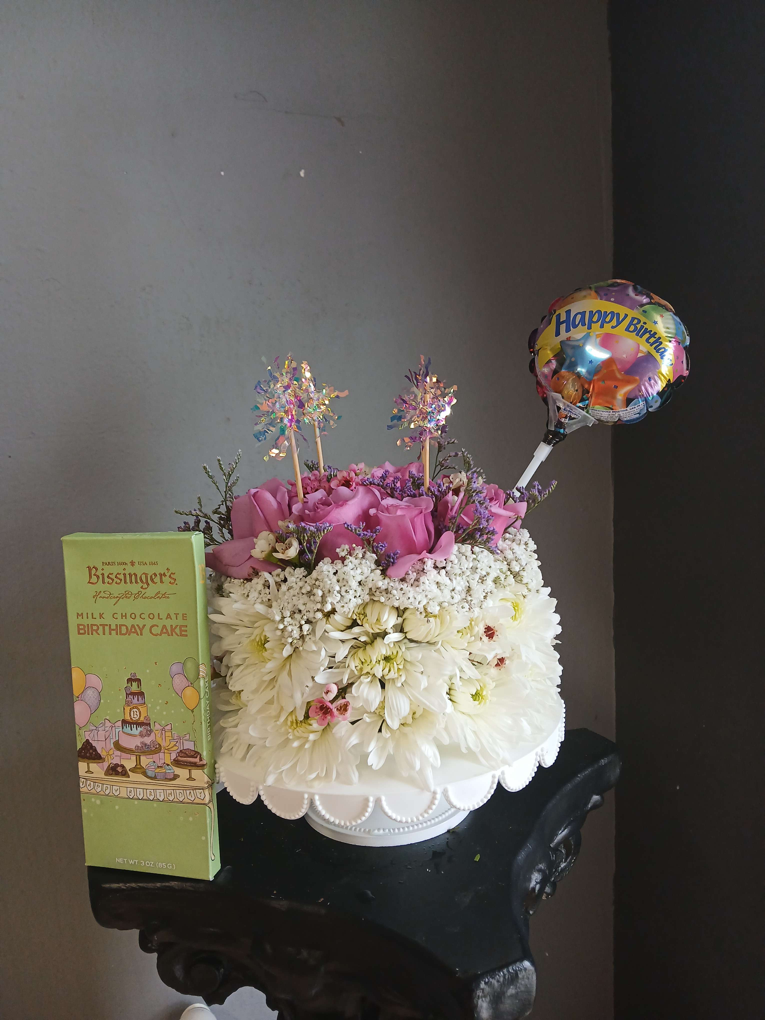 Birthday flower arrangement with a balloon and chocolate box