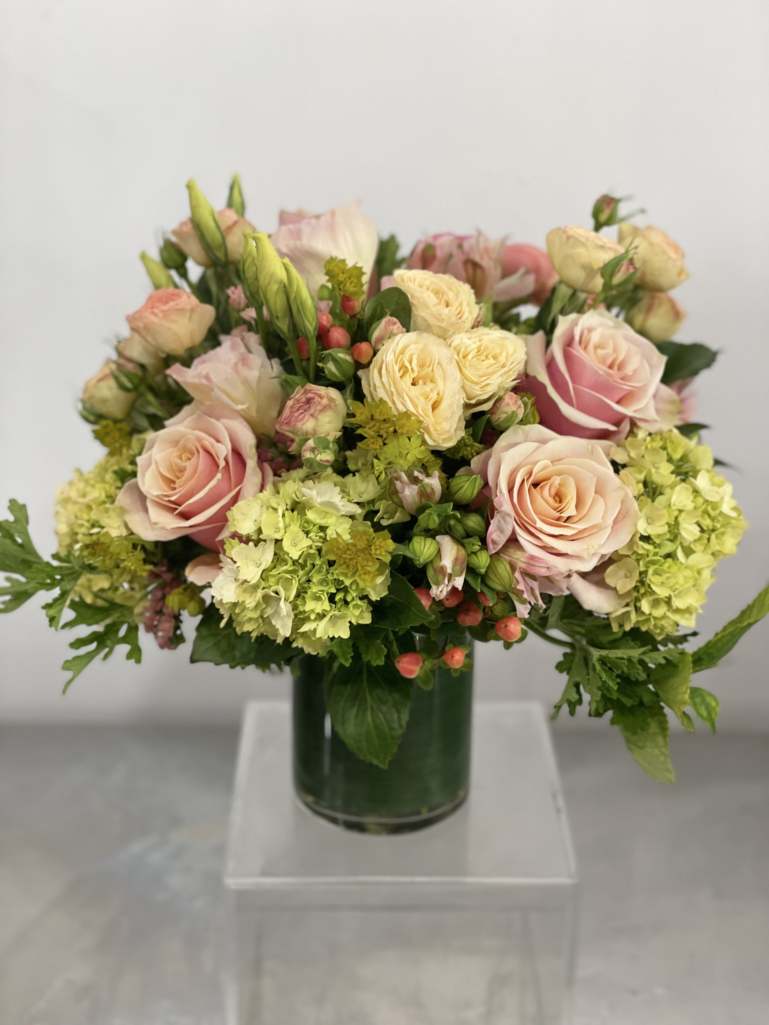Pastel Love  - This sweet arrangement will be composed of beautiful peachy pink, bright green and butter yellow flowers. We will select the best that the market has to offer.  Designers Choice.   NOTES: We will choose the freshest and most interesting ingredients at the market to make this arrangement shine. Vessels may be substituted depending on availability.   If any design element such as color or flower/foliage are very important to your order please contact us to ensure availability first by calling the shop at  415 751 2747 