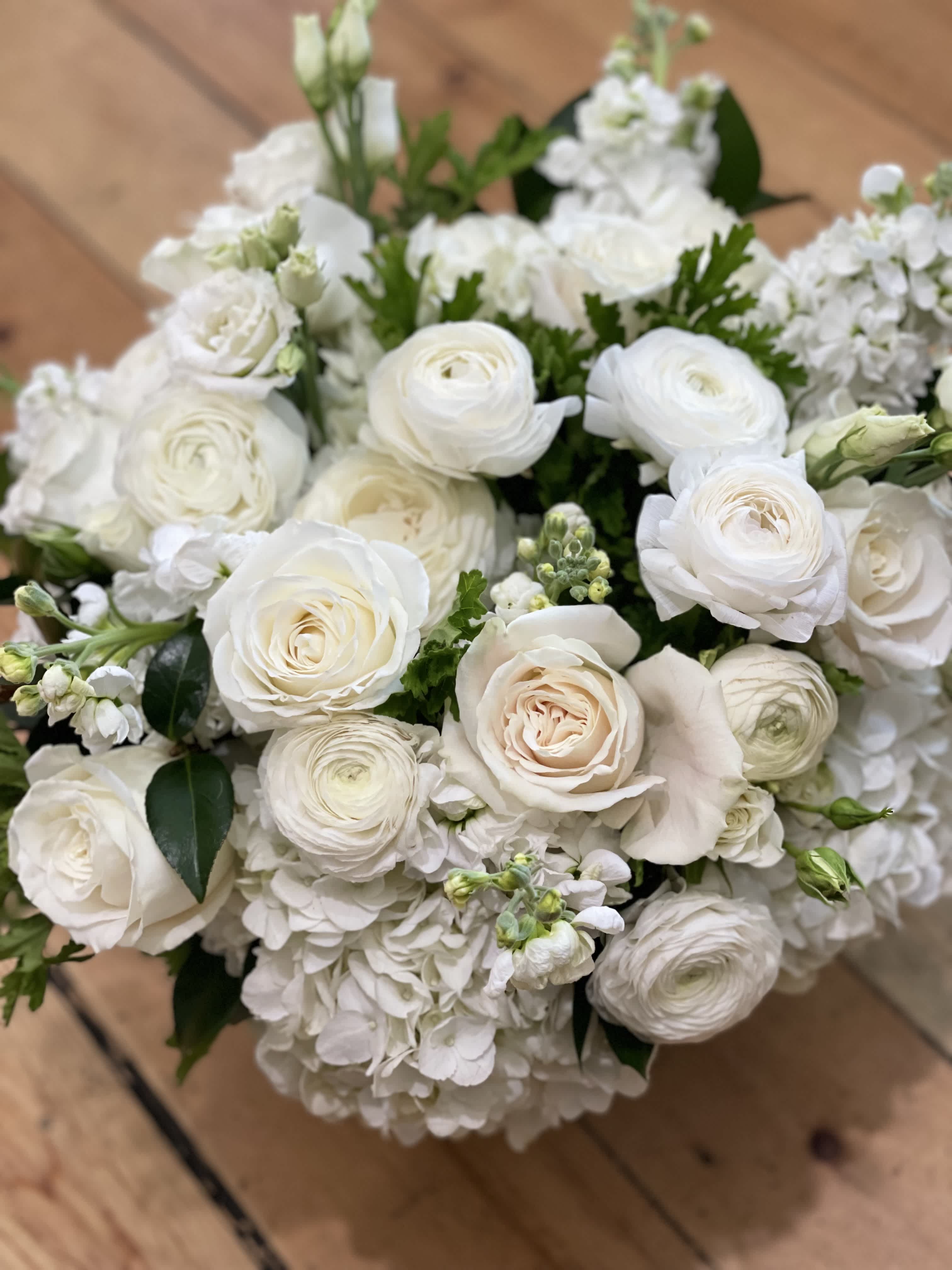 Bey Good  - Designers Choice means you trust us to source the most beautiful flower to fill a glass vase with the very best the market has to offer in premium green and white. this makes white the impact on your recipient. These pictures are examples of our work so you can get a sense of what we will send out.  (PICTURED IS DELUXE)  Standard is appropriate for a side table. Deluxe is appropriate for a coffee table. (PICTURED- Peonies will be used IF available) Premium is a state mean arrangement filled with premium blooms. (Peonies will be used if available))  Saturday and Same Day may be available if you call the shop.   ** 415 751 2747 10:00AM -5:00PM  