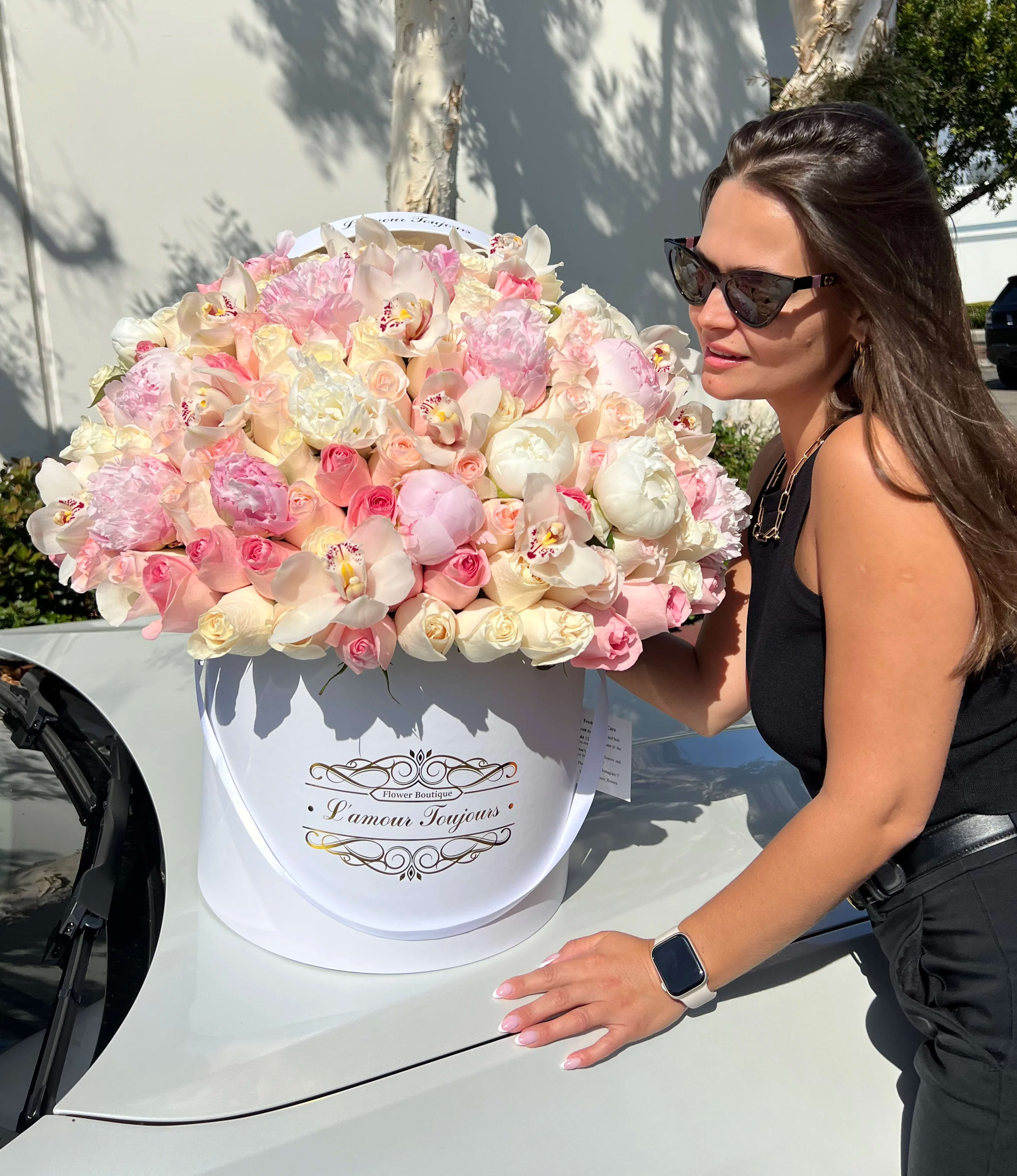 Large pastel flower box with pink and white blooms