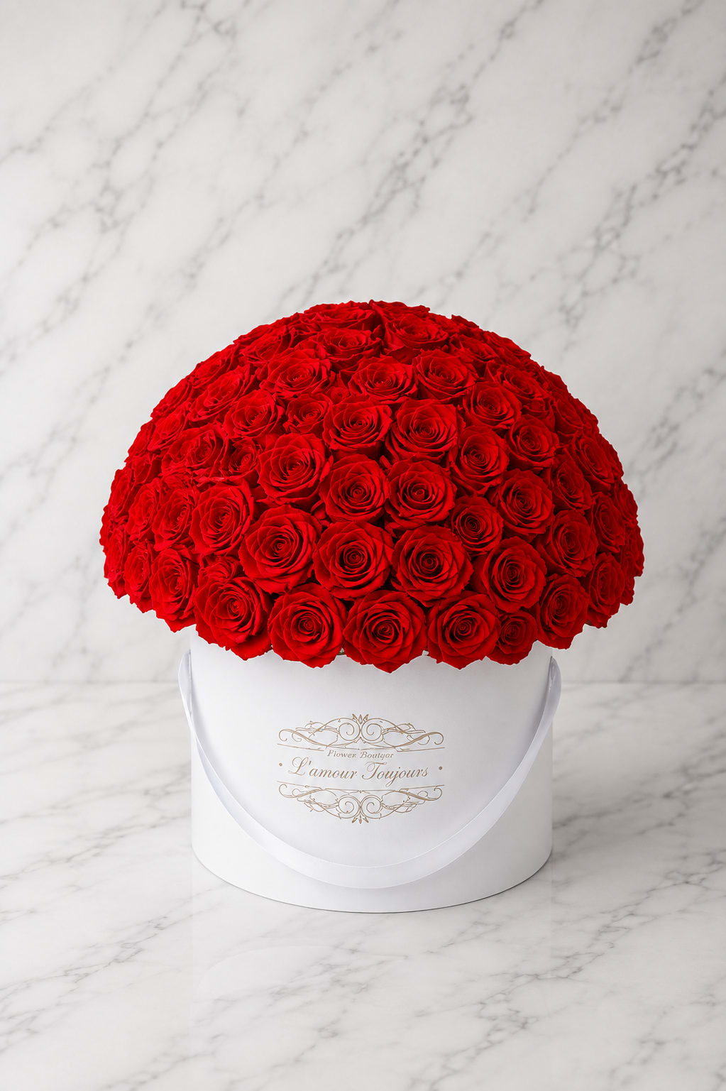 Large dome of red roses in a white round box