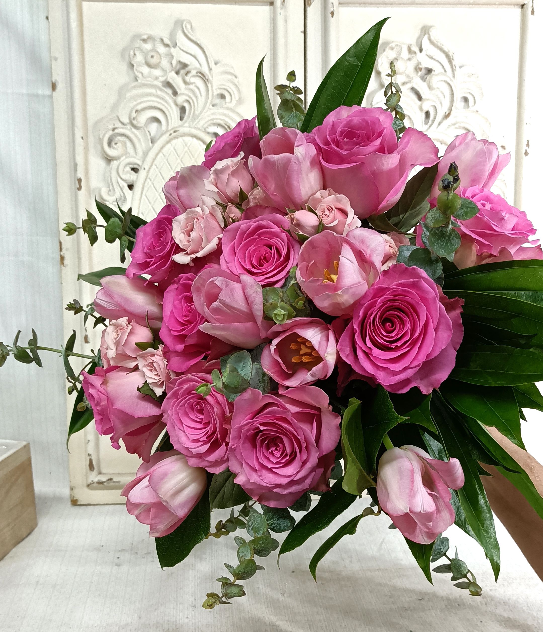 Pink rose and tulip bouquet with eucalyptus greenery