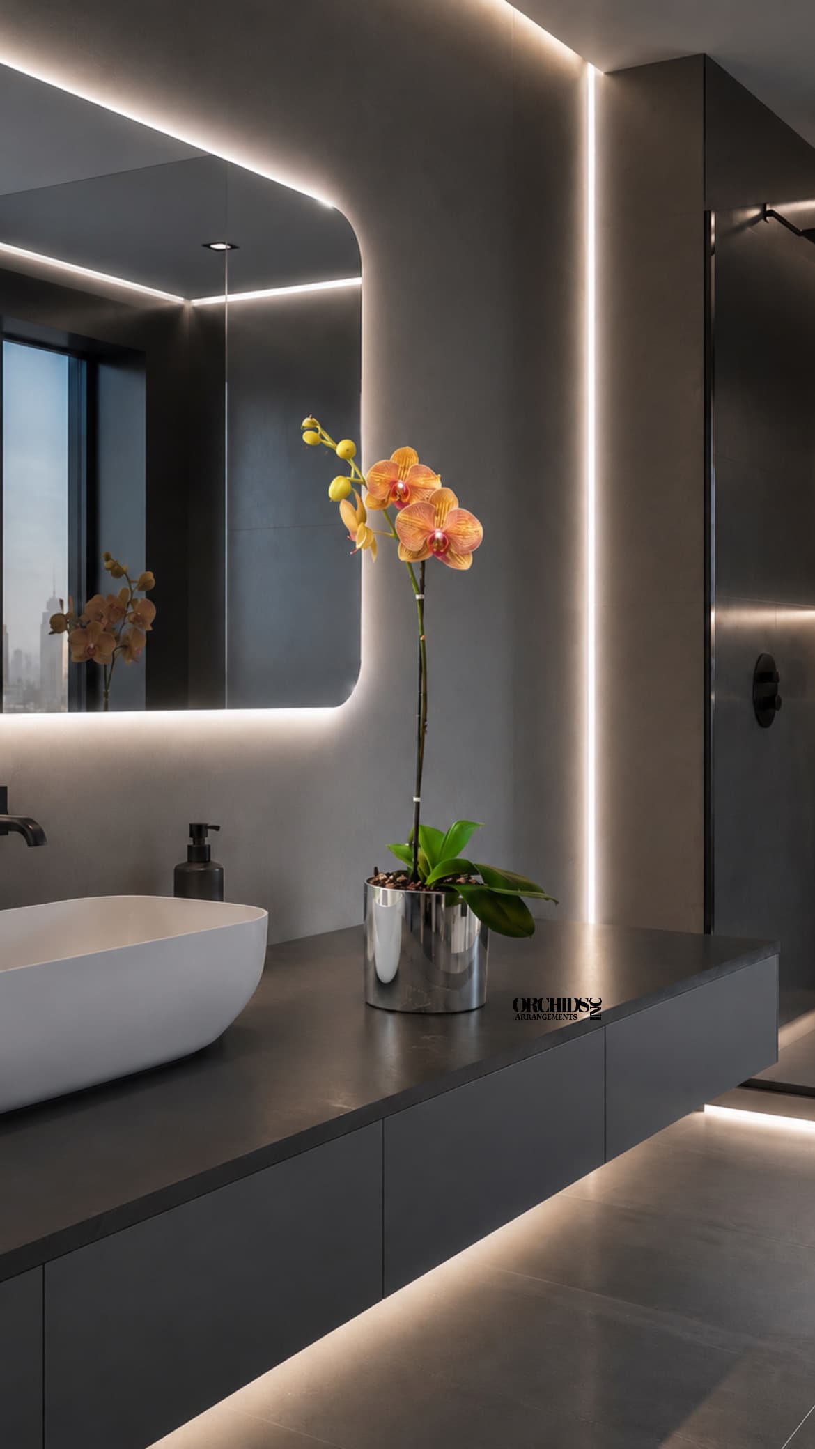 Potted orchid with orange blooms in a silver container on a countertop