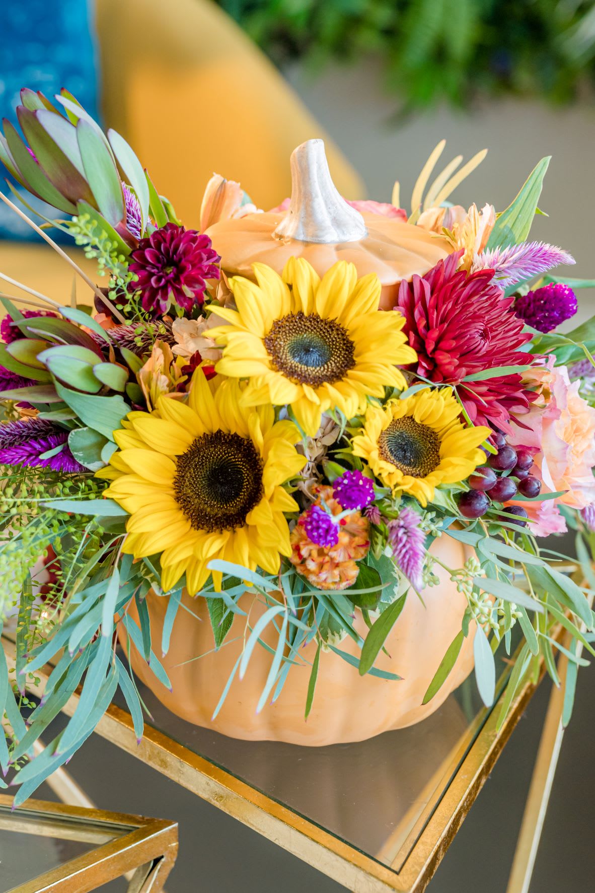 Pumpkin Pie  - This ceramic vessel is filled with some of the most favorite autumn blooms, featuring sunflowers, roses and seasonal textures hand designed to grace your holiday table. 