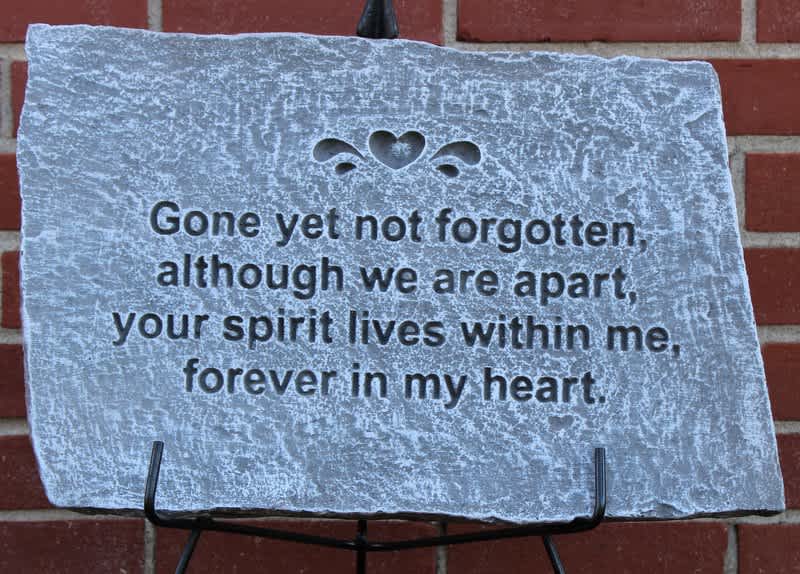 Memorial stone plaque with an engraved sympathy message