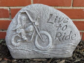 Stone sign with a motorcycle and the words "Live to Ride"