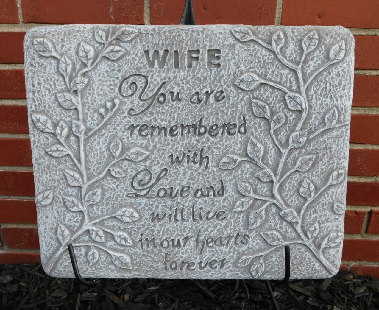 Decorative stone plaque with the words "WIFE You are remembered with Love and will live in our hearts forever"