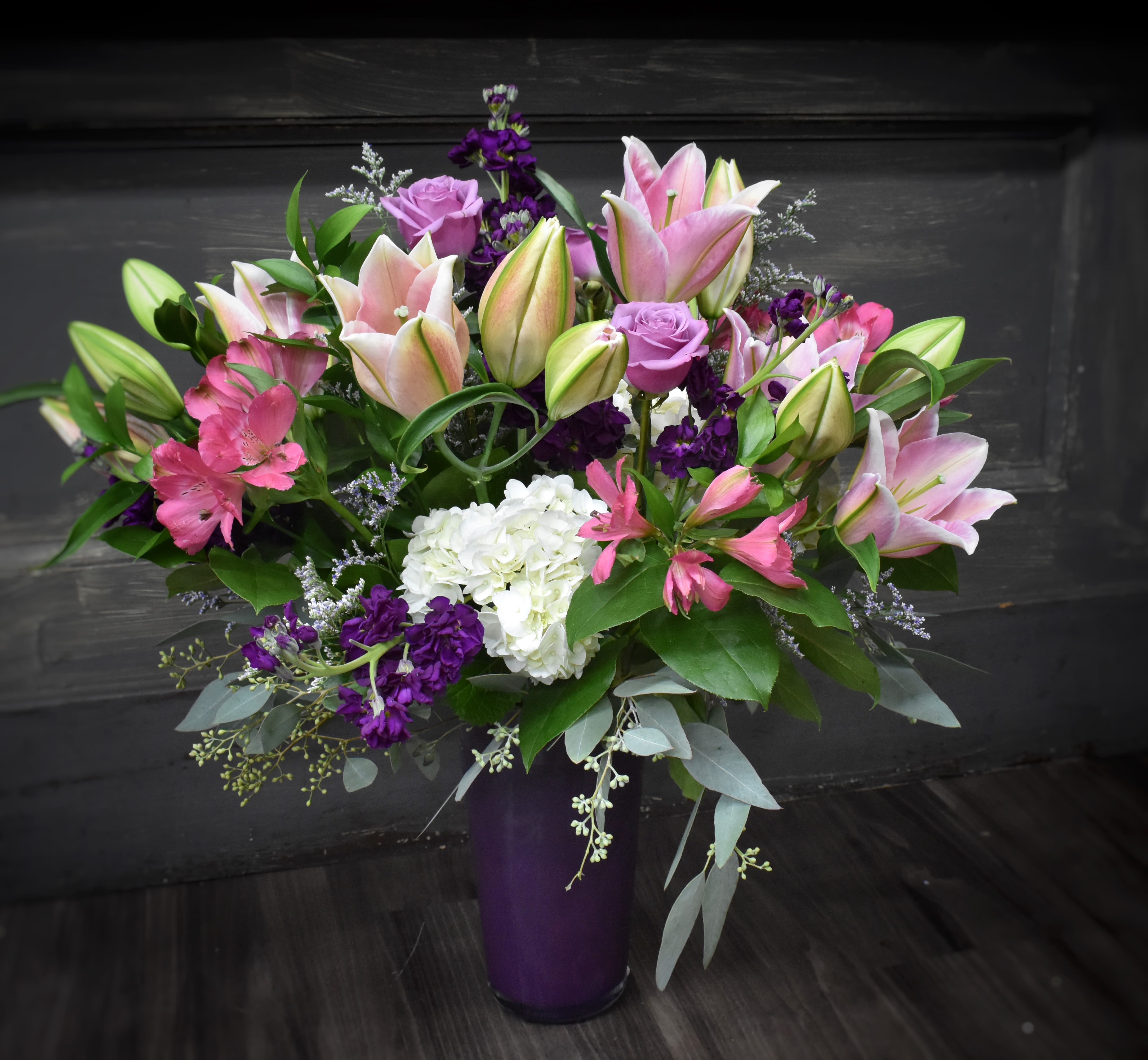 Blossom Belle - This large, luxurious mix of premium flowers includes gerbera daisies, roses, lilies, stock, clematis, and hydrangea is a tender way to express your love. A grand display for your special someone!