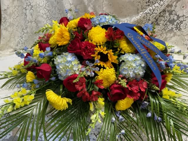 Colorful Casket Spray - Garden mix of flowers to adorn your loved ones casket.