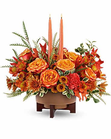 Modern Autumn Centerpiece - Metal planter with copper finish and wooden stand, with variety of fall flowers and candles.