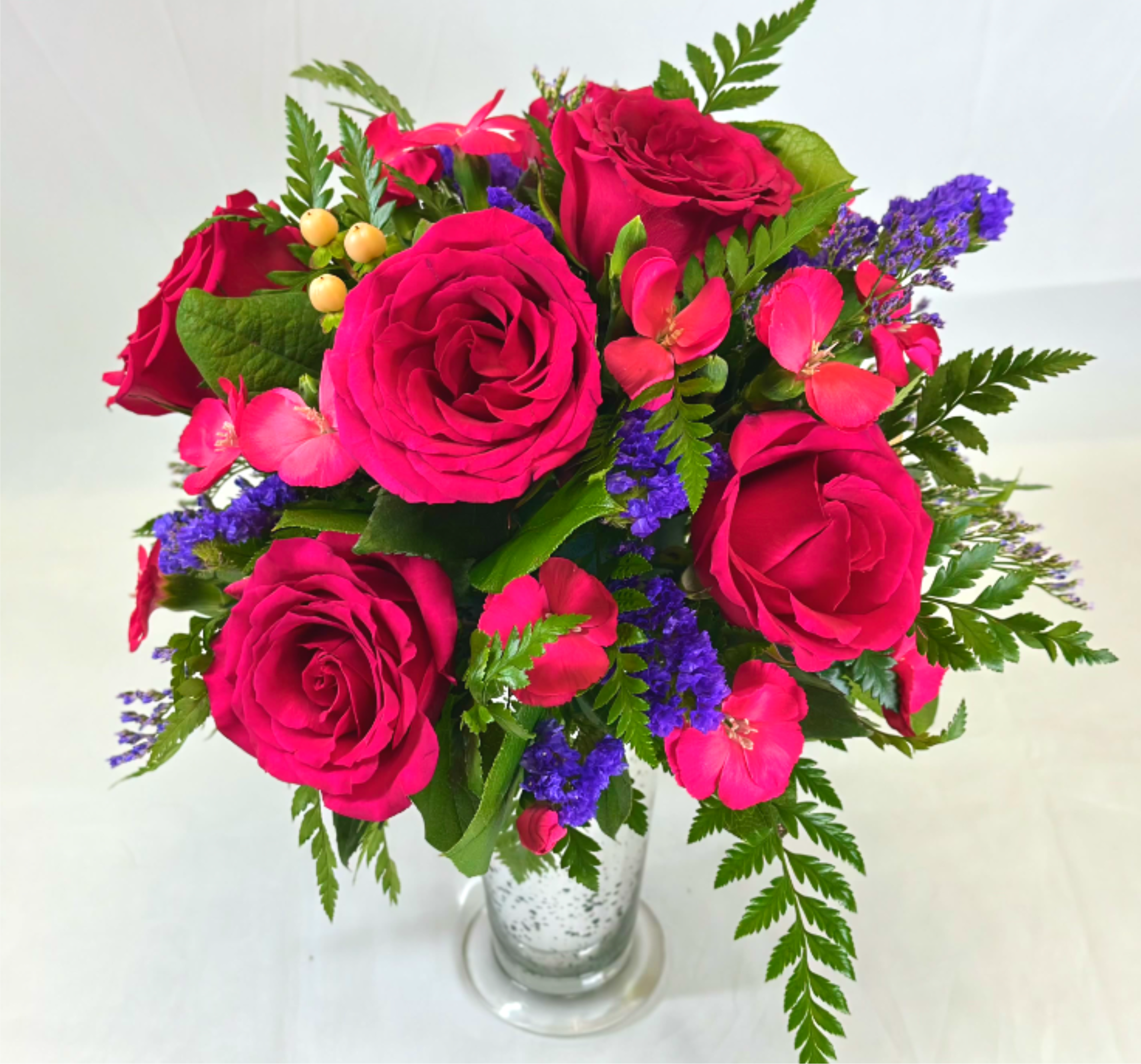 Pack a Punch of Color - There are times when bold bright colors are the only thing that will do, and this exclusive Leary's Flowers arrangement is perfect for those times! With hot pink, bright purple, and a few accent colors, this stunning display is sure to be a hit.  This would be a great gift for birthdays, Valentine's, or any occasion to brighten someone's day. 