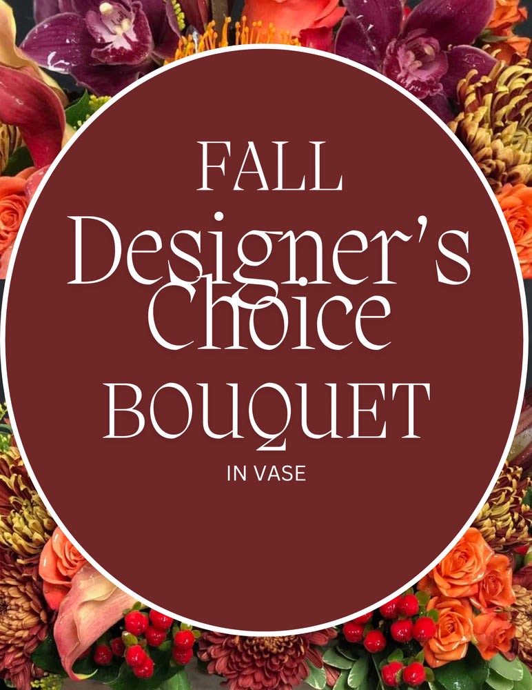 Fall designer's choice bouquet in a vase with mixed autumn flowers