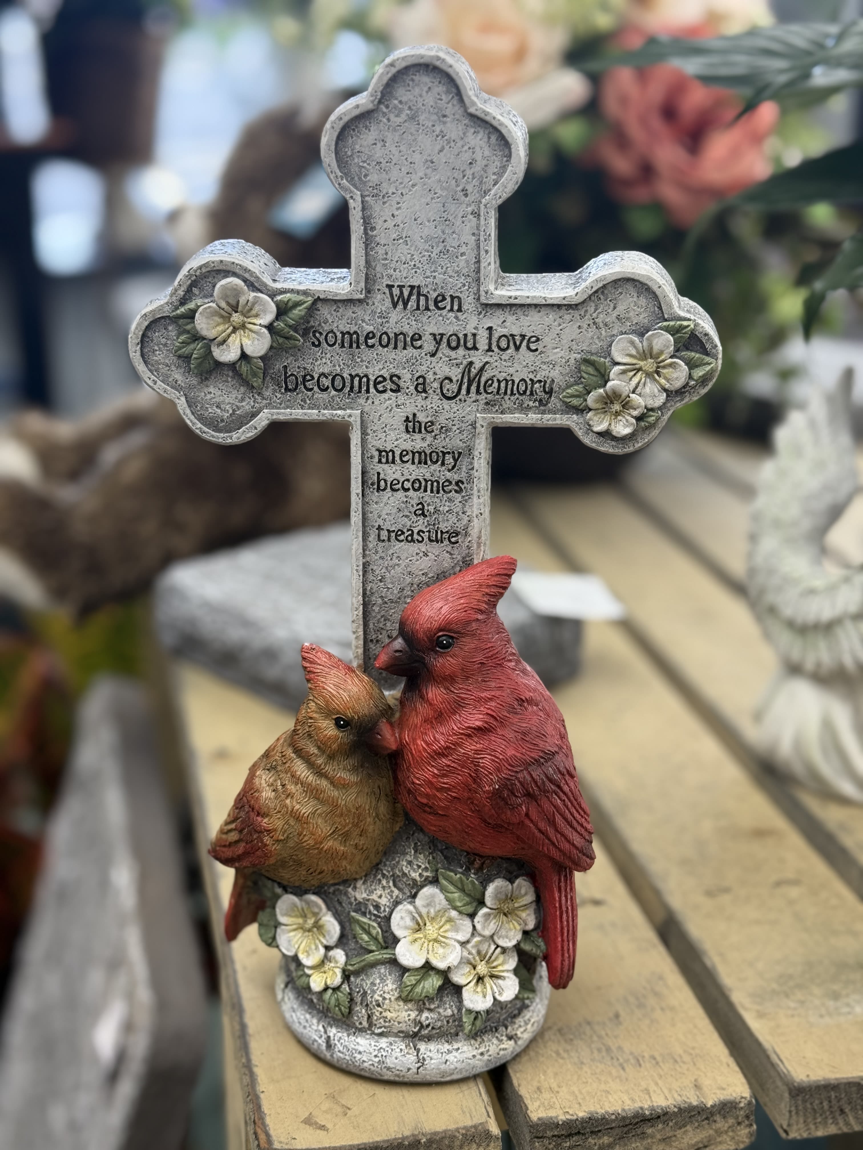 Decorative memorial cross with two birds and floral accents