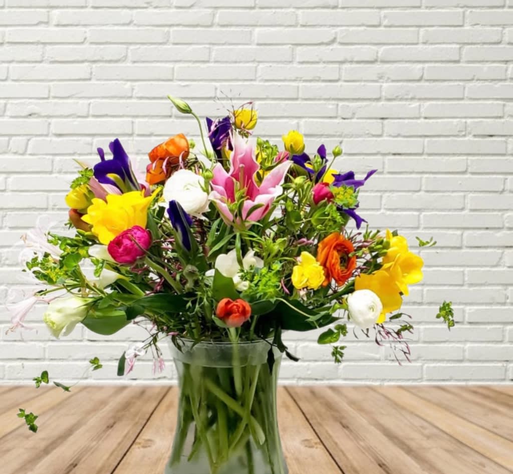 Colorful mixed bouquet in a clear glass vase