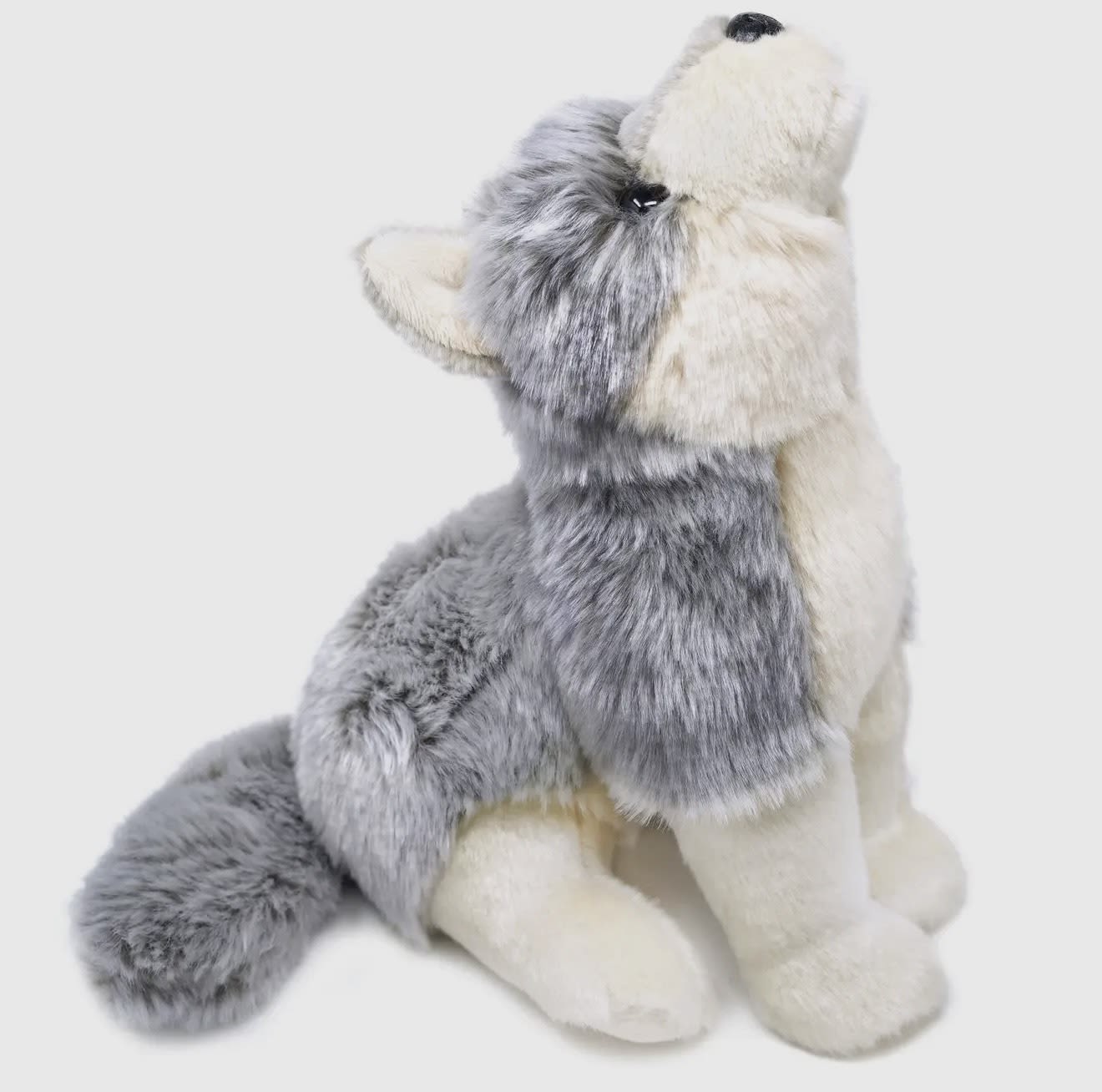 Plush gray and white husky stuffed animal sitting upright